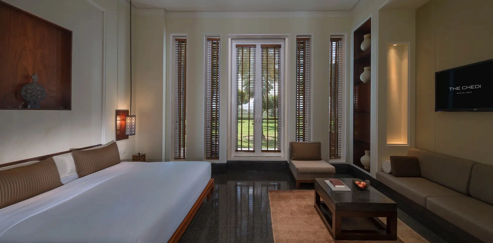 deluxe club room bedroom at the chedi muscat oman