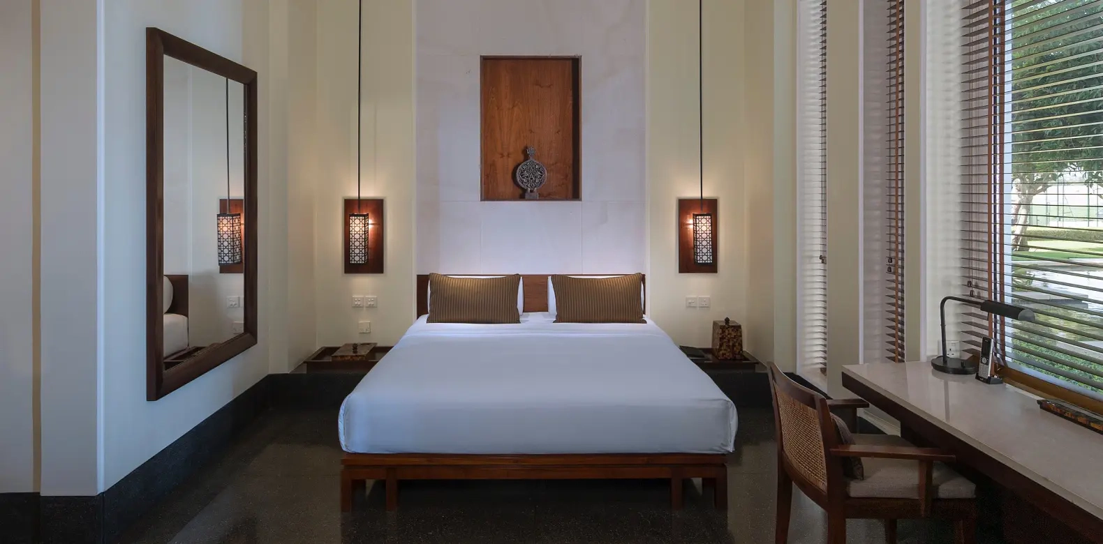 deluxe room bedroom at the chedi muscat oman