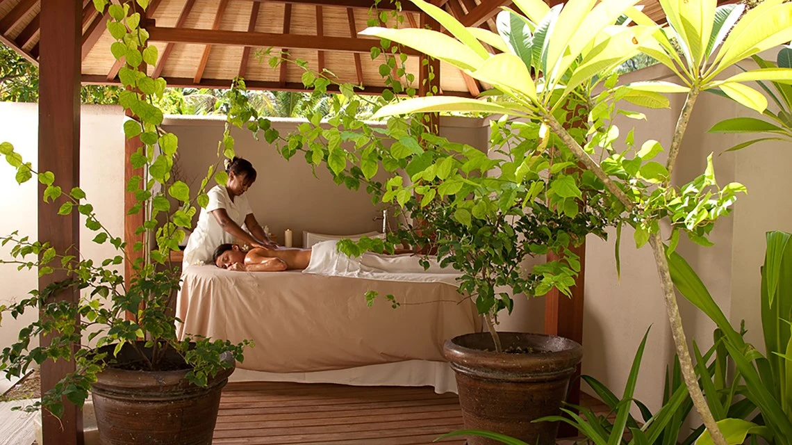 denis private island seychelles beach cottage massage with relaxing spa treatment on a private terrace surrounded by tropical gardens and ocean breeze