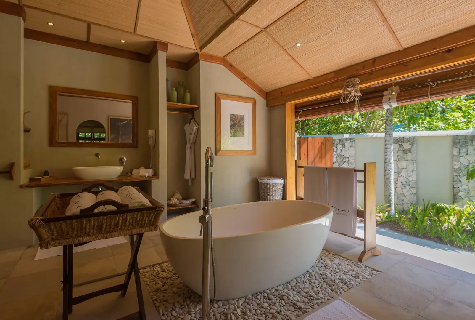 denis private island seychelles beach villa bathroom with luxurious soaking tub, modern fixtures, and tropical or ocean views