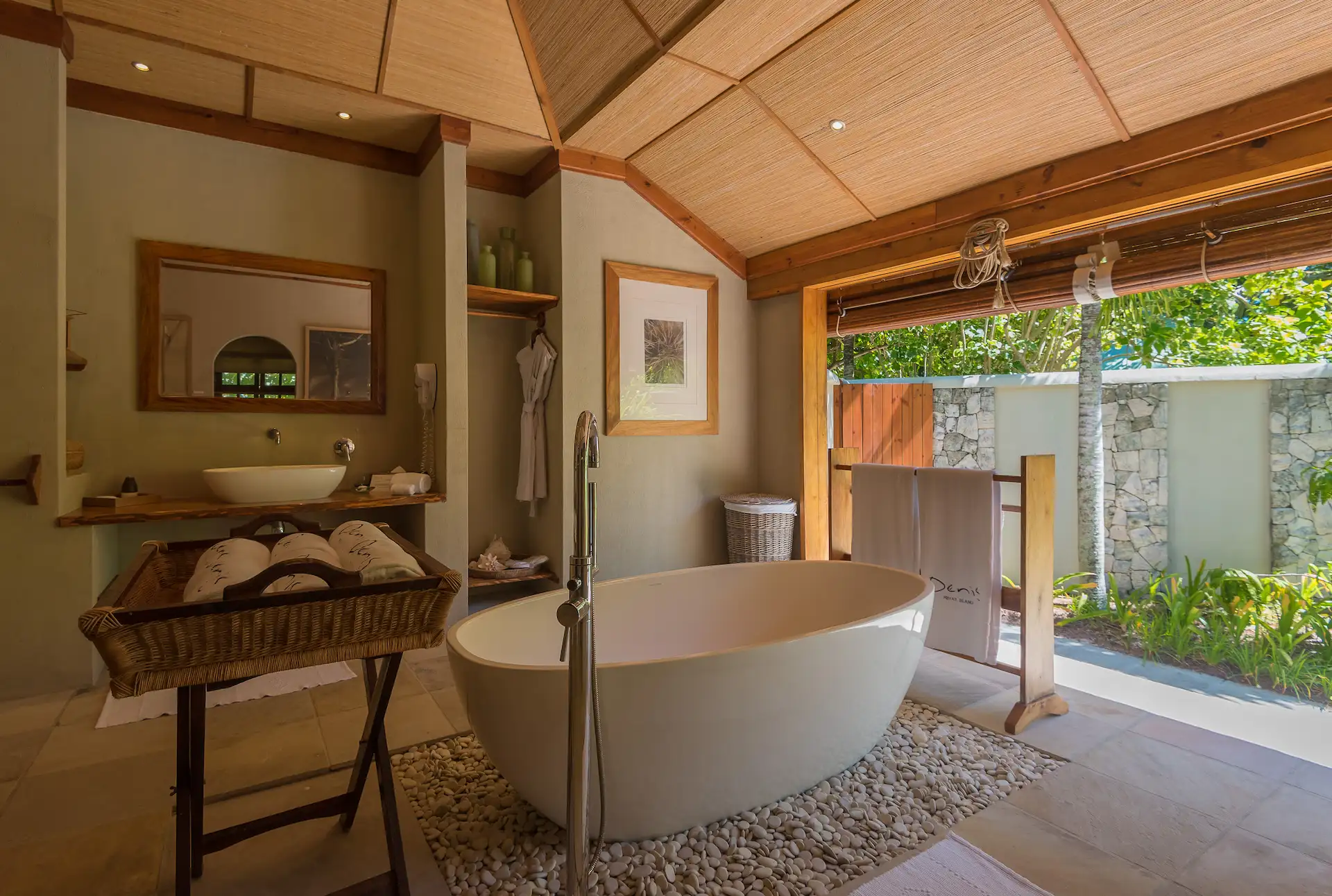 denis private island seychelles beach villa bathroom with luxurious soaking tub, modern fixtures, and tropical or ocean views