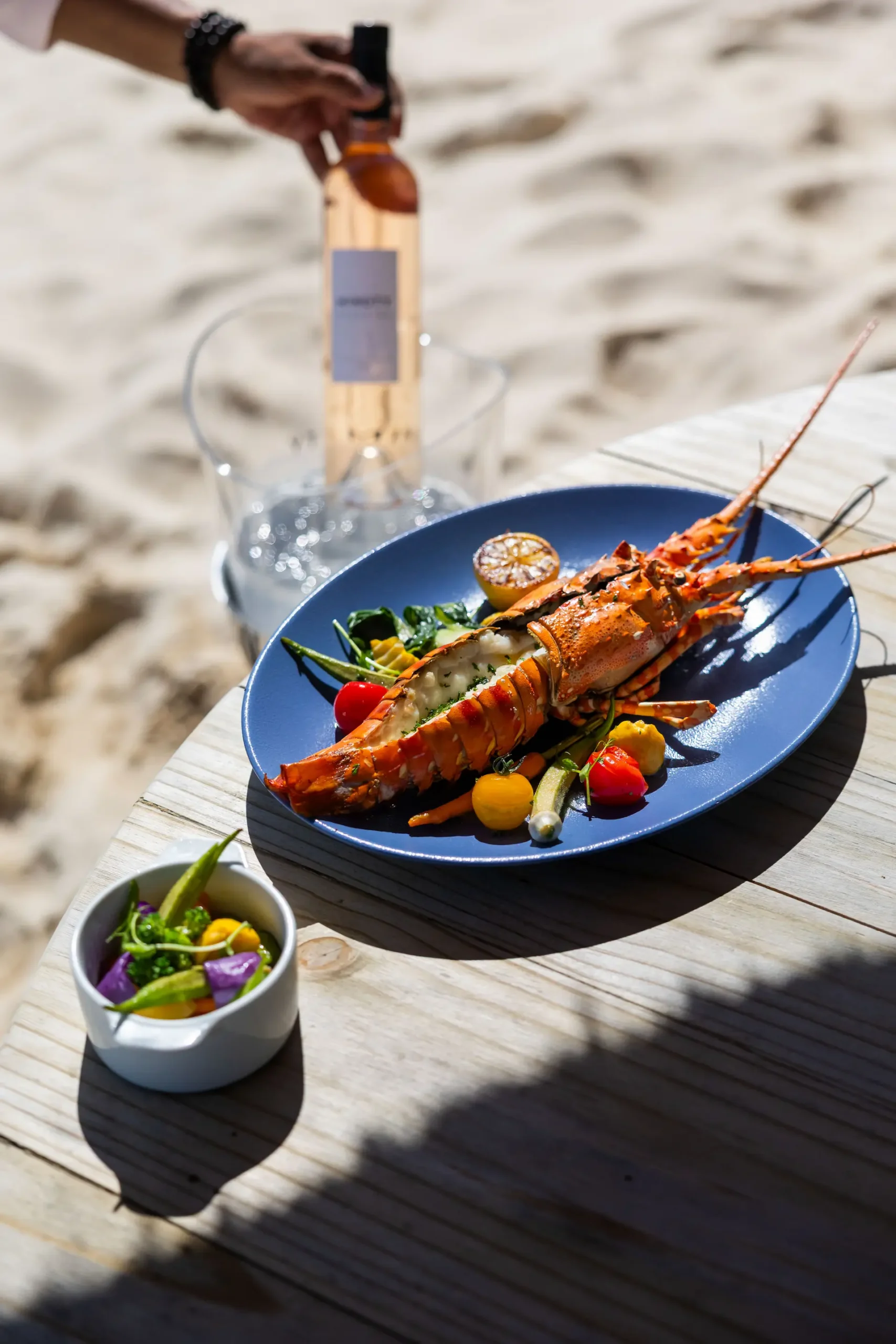 dinarobin mauritius beach bar lobster dish on table