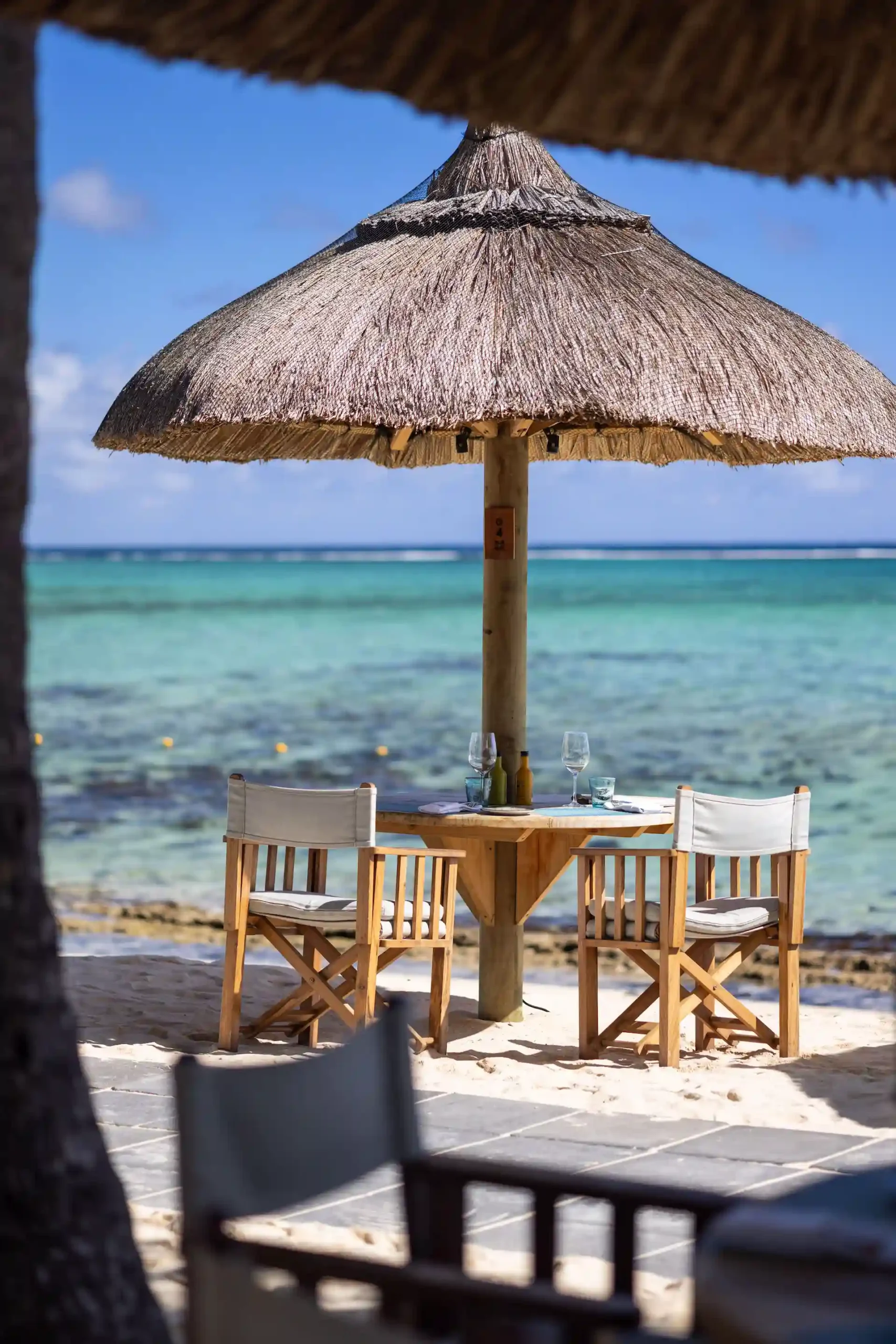 dinarobin mauritius beach bar table with drinks and ocean view