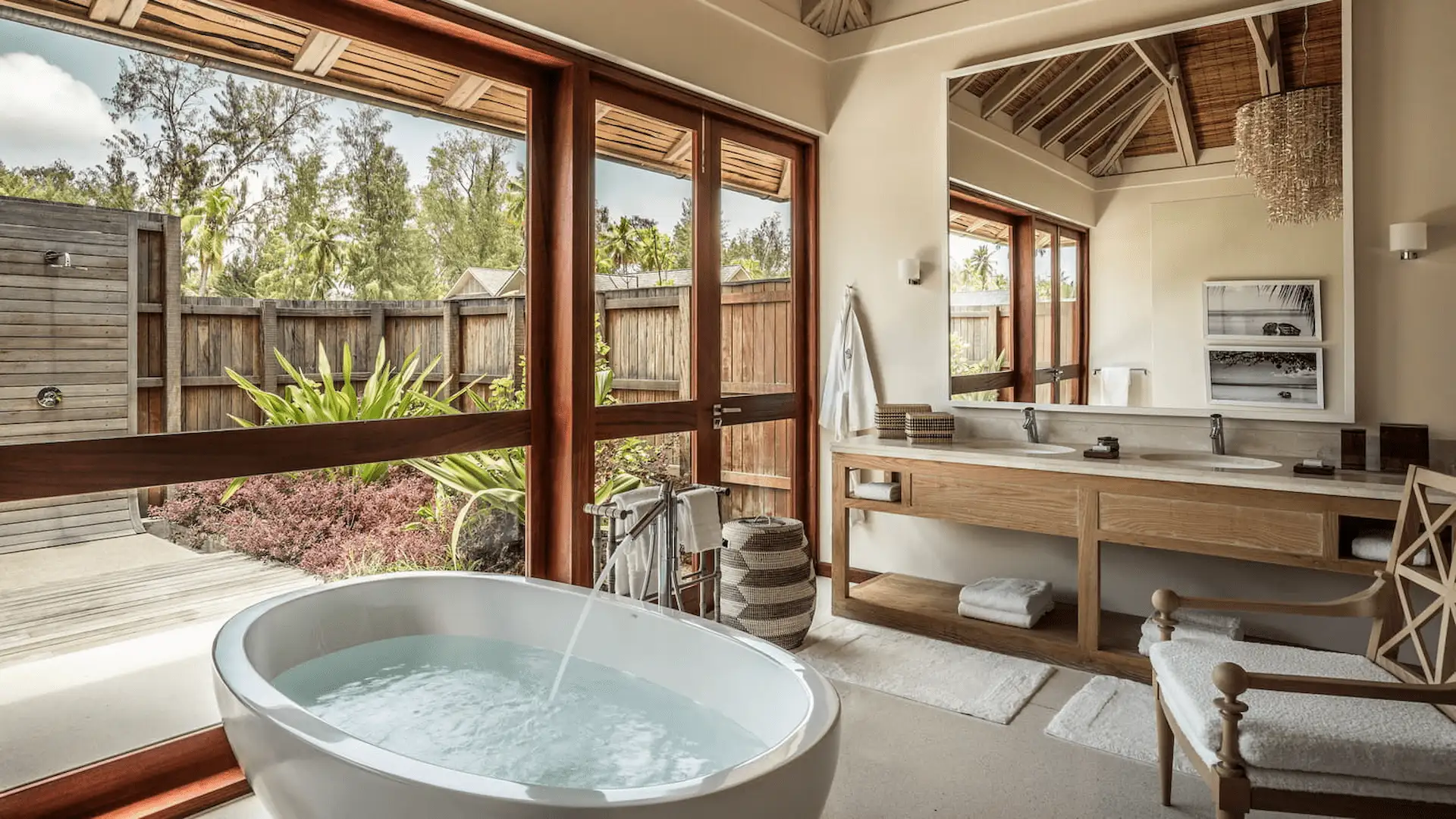 bathroom in a beach pool villa at four seasons resort desroches seychelles with bathtub and modern fittings
