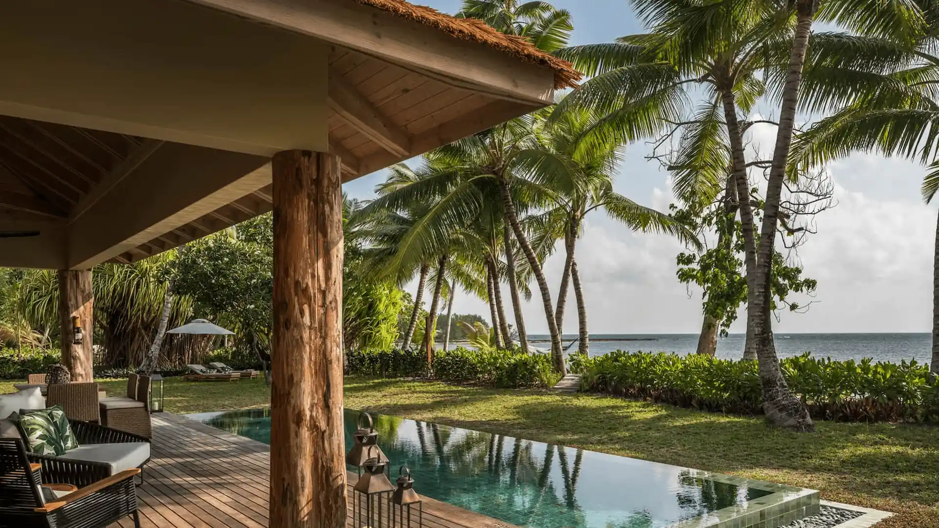 "private pool at a two bedroom sunset beach suite at four seasons resort desroches seychelles with seating area and tropical surroundings