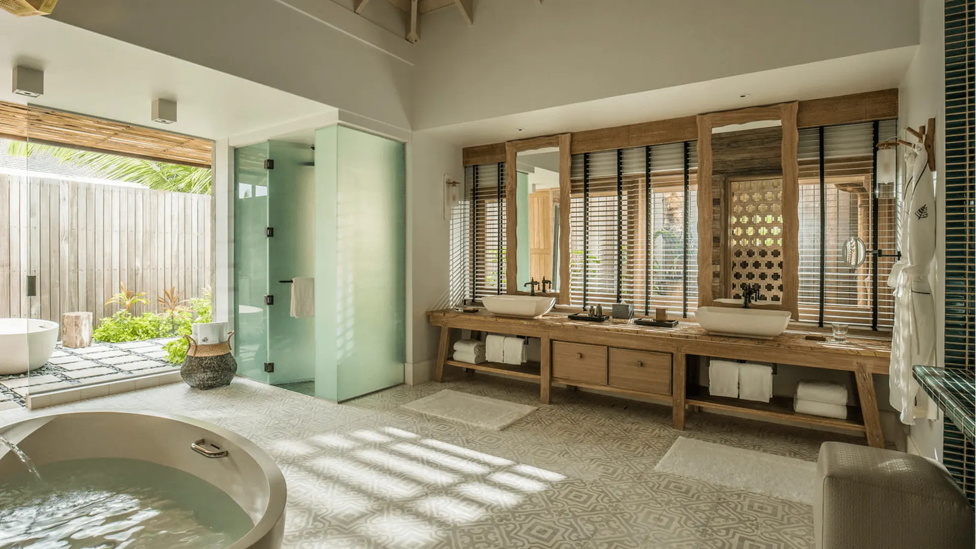 bathroom in a three bedroom presidential villa at four seasons resort desroches seychelles with bathtub and modern fixtures