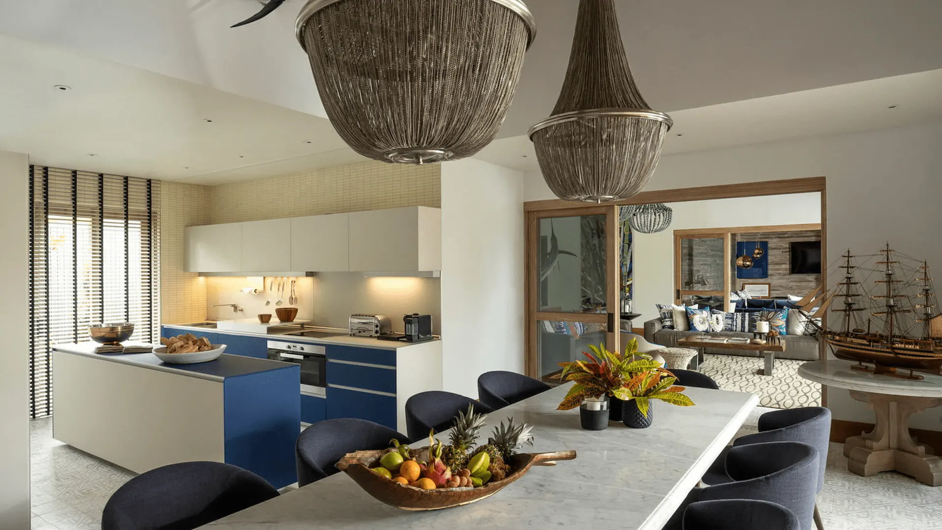 kitchen in a three bedroom presidential villa at four seasons resort desroches seychelles with modern appliances and open living space
