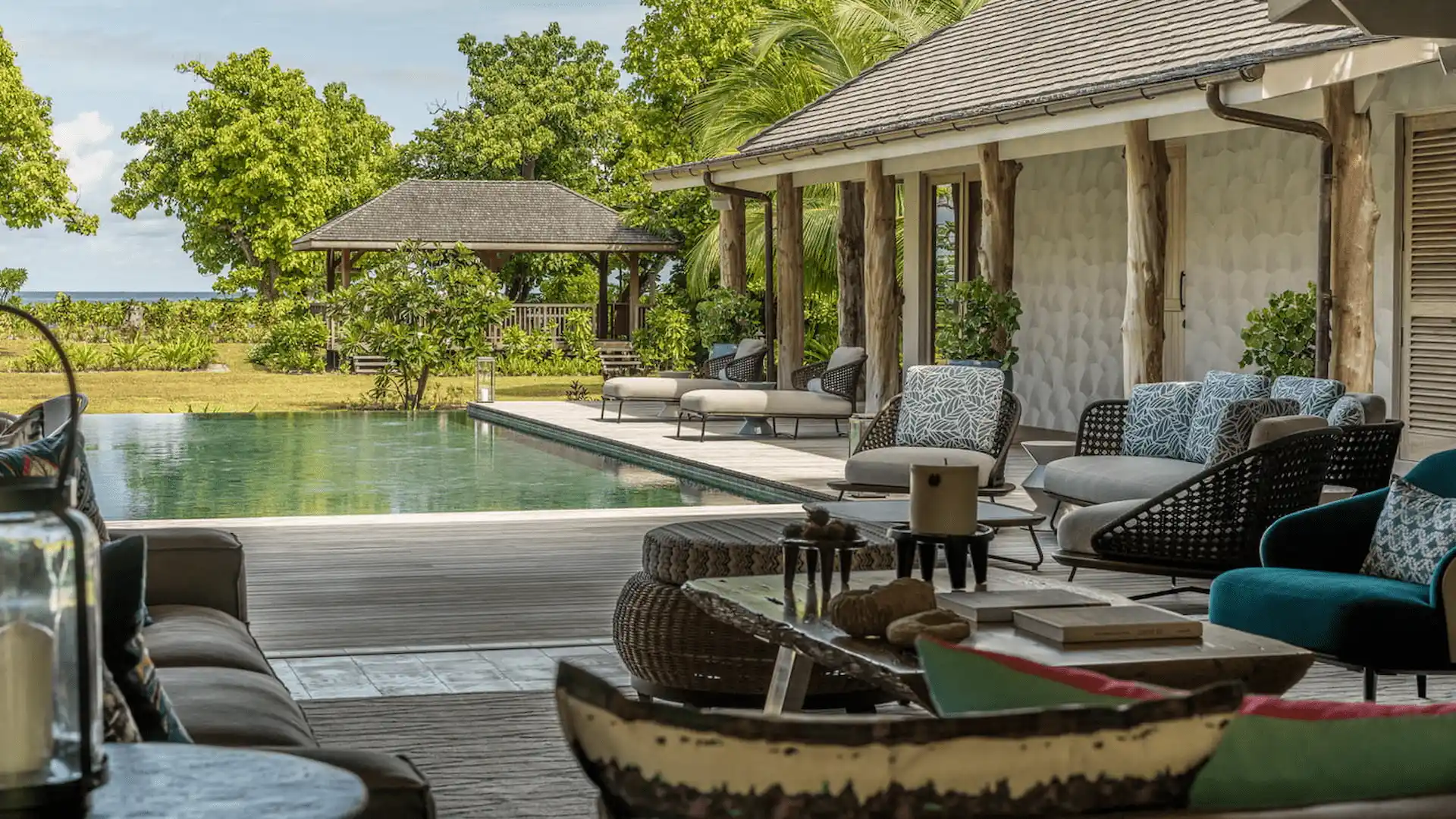private pool at a three bedroom presidential villa at four seasons resort desroches seychelles surrounded by tropical greenery and seating areas