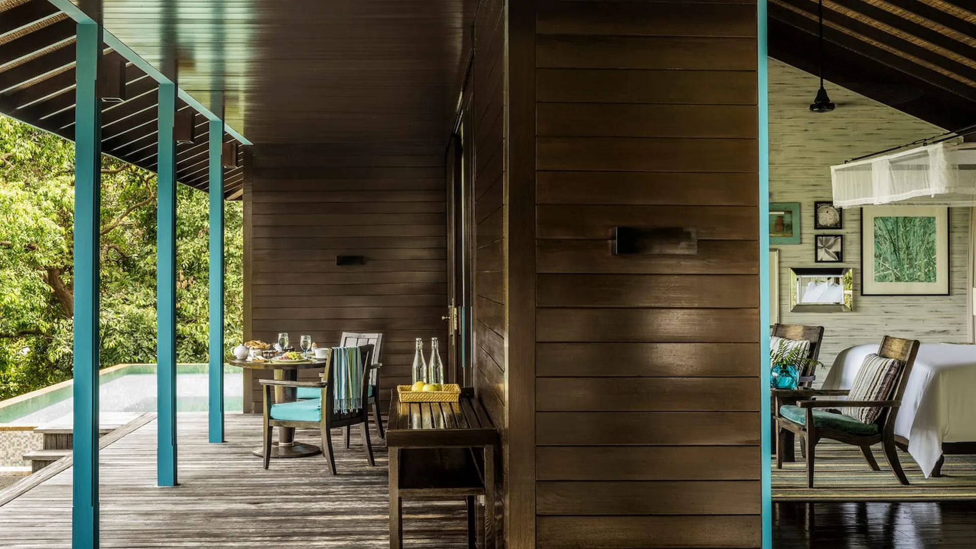 decking and private pool of a garden view villa at Four Seasons Resort Seychelles surrounded by tropical greenery
