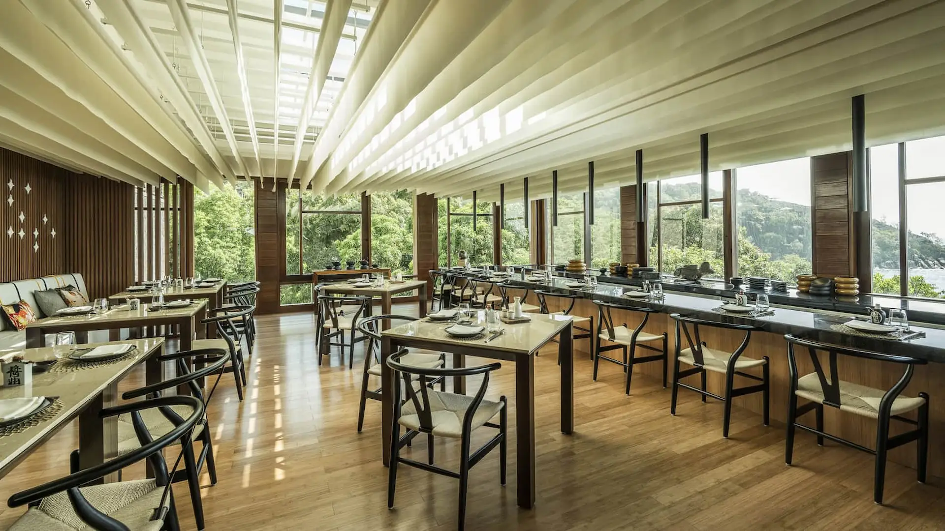 koi restaurant at Four Seasons Resort Seychelles with elegant indoor dining space and contemporary asian inspired decor
