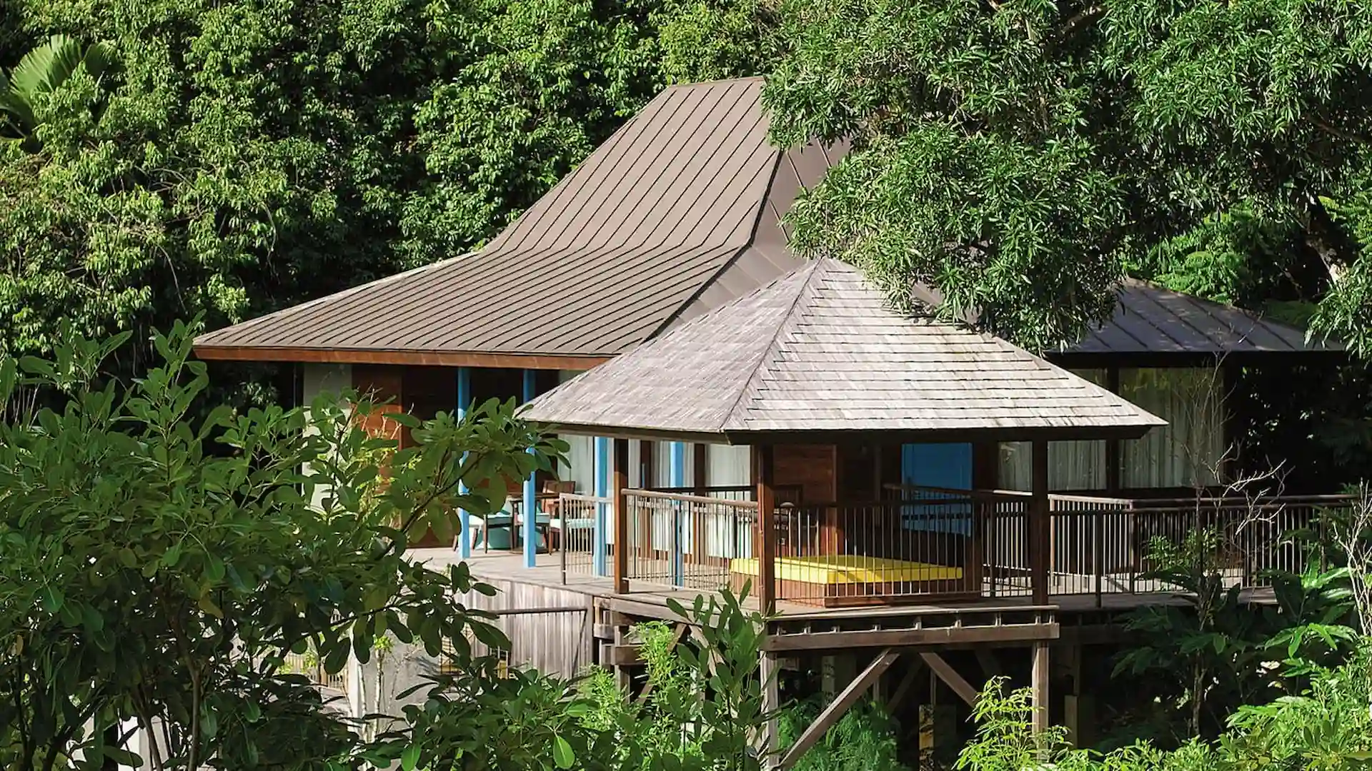 hill view from an ocean view villa at Four Seasons Resort Seychelles overlooking tropical greenery and the ocean beyond