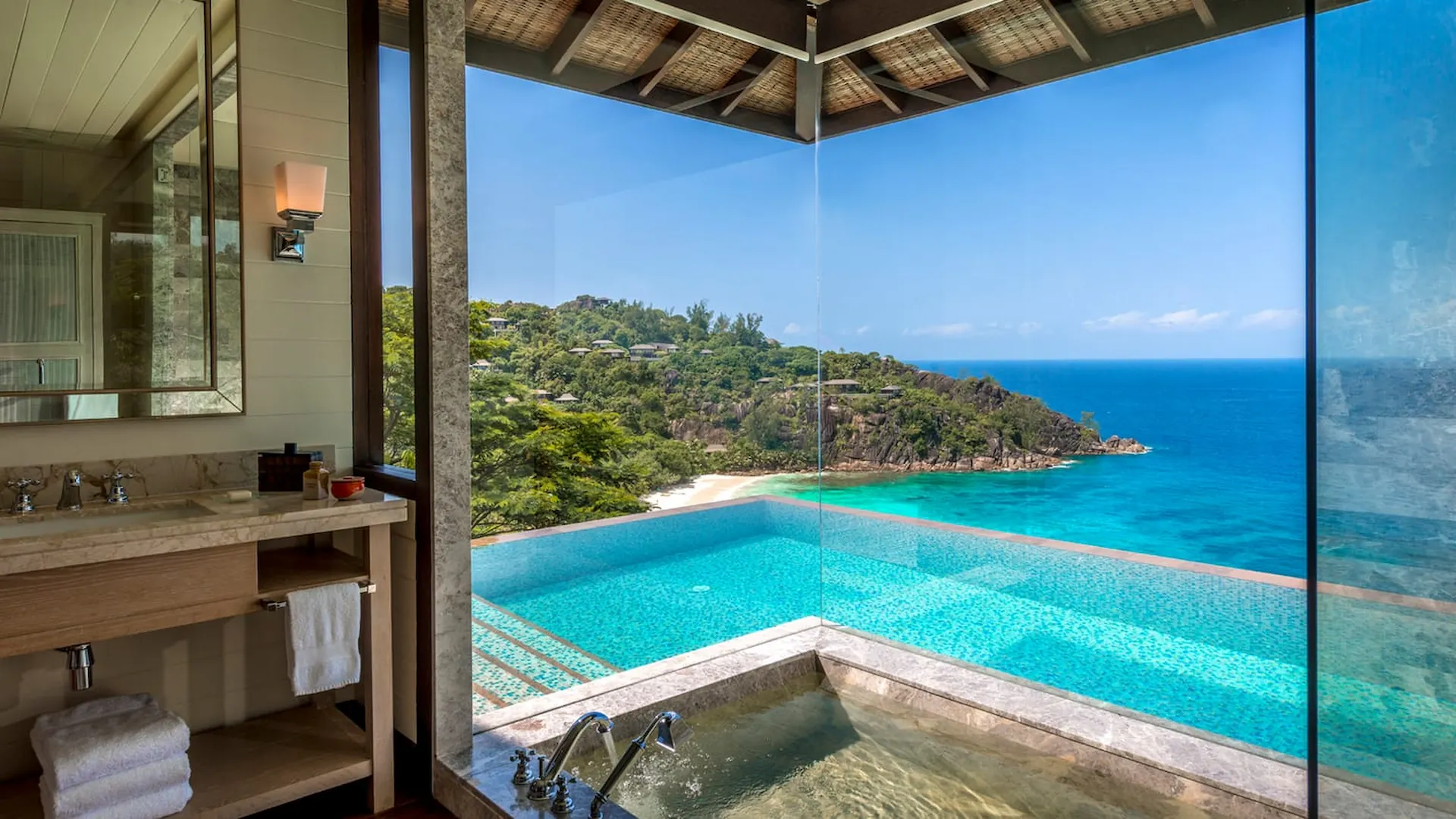 private pool of a serenity villa at Four Seasons Resort Seychelles surrounded by tropical greenery