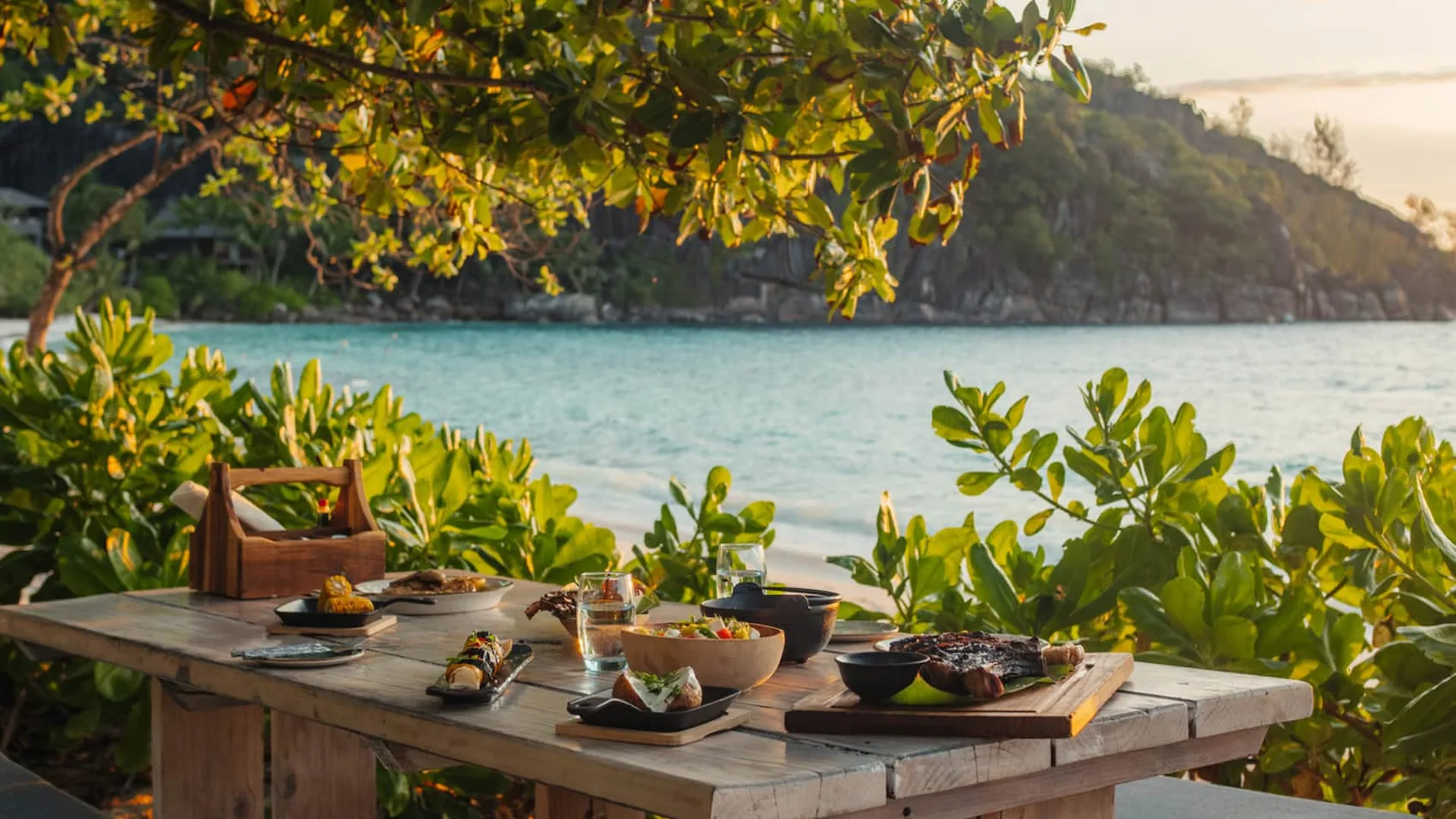 steak shack at Four Seasons Resort Seychelles with beachfront dining area and relaxed outdoor seating near the ocean