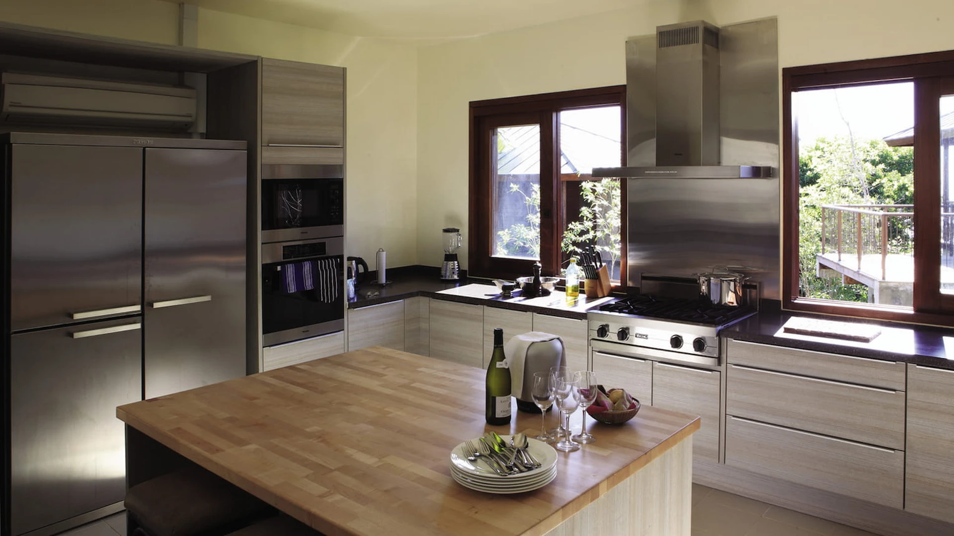 kitchen in a three bedroom residence at Four Seasons Resort Seychelles with modern appliances and open layout