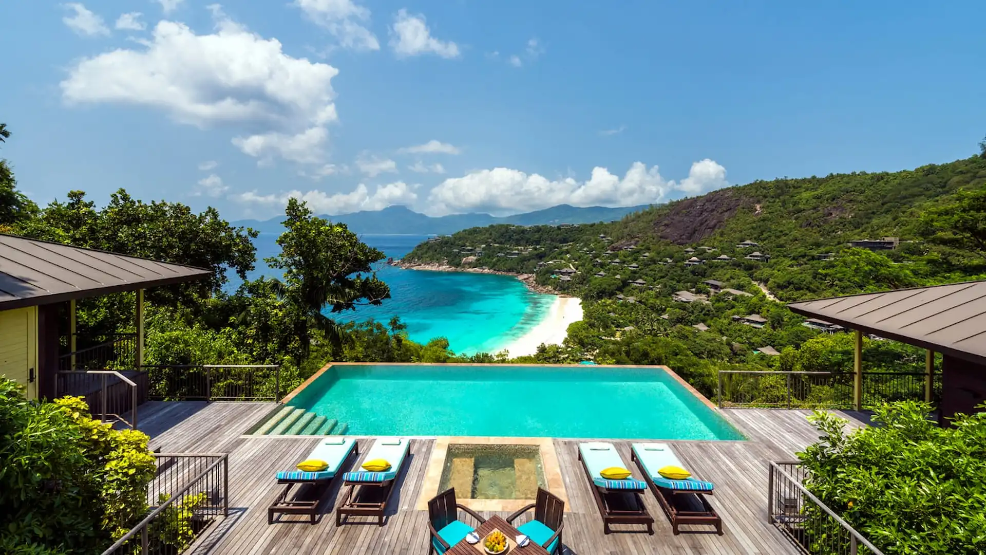 private pool of a two bedroom hillside ocean view villa at Four Seasons Resort Seychelles overlooking tropical greenery and the ocean