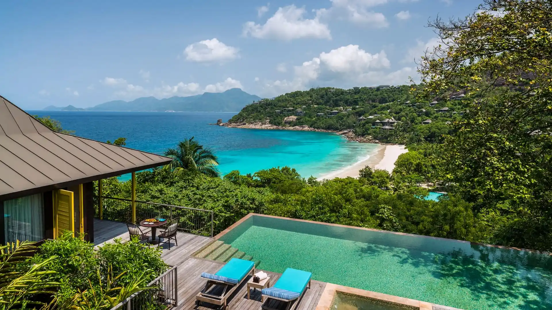 private pool of a two bedroom ocean view villa at Four Seasons Resort Seychelles overlooking tropical greenery and the ocean