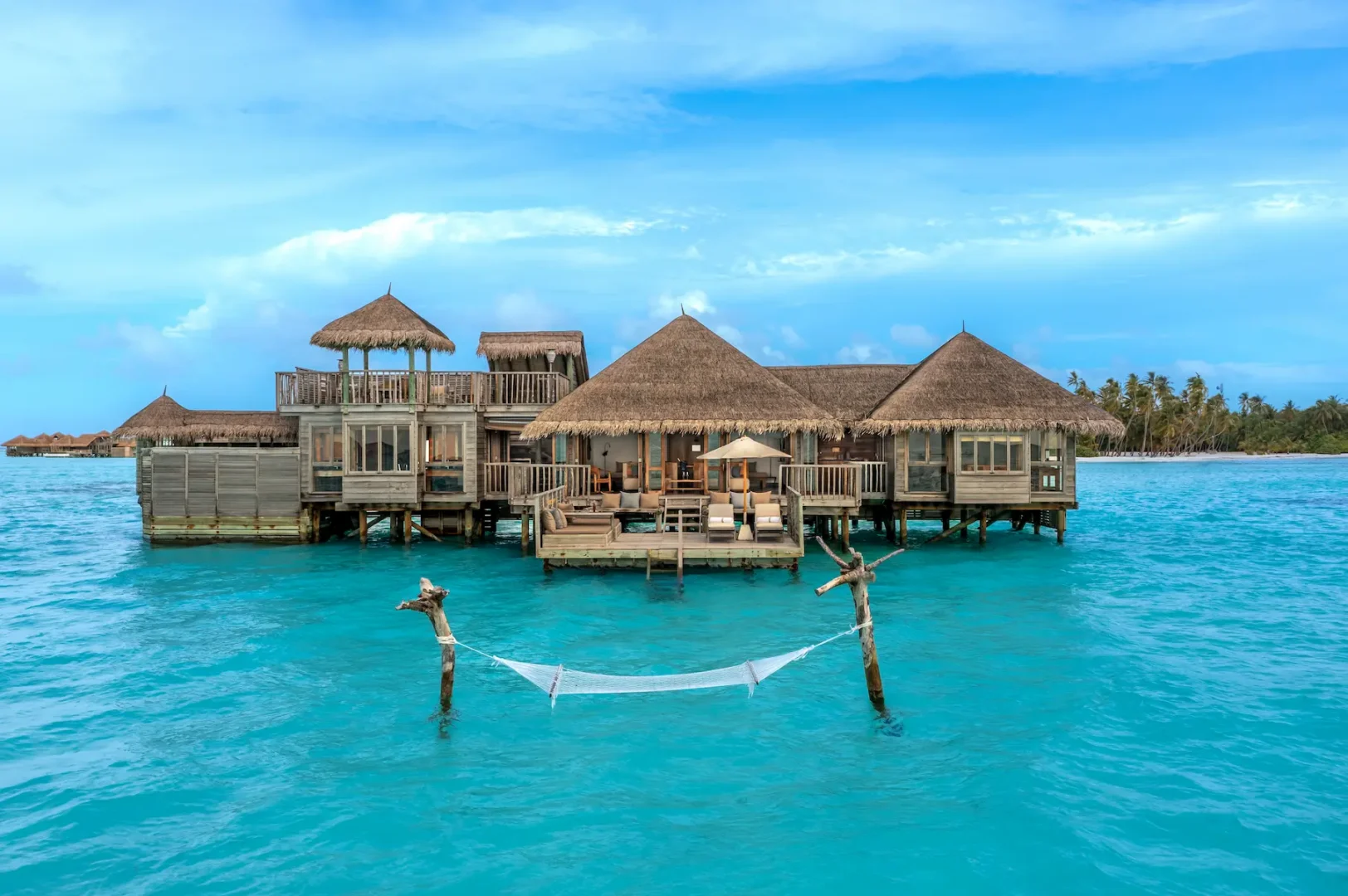 an inviting crusoe residence exterior at gili lankanfushi maldives set above calm turquoise lagoon waters
