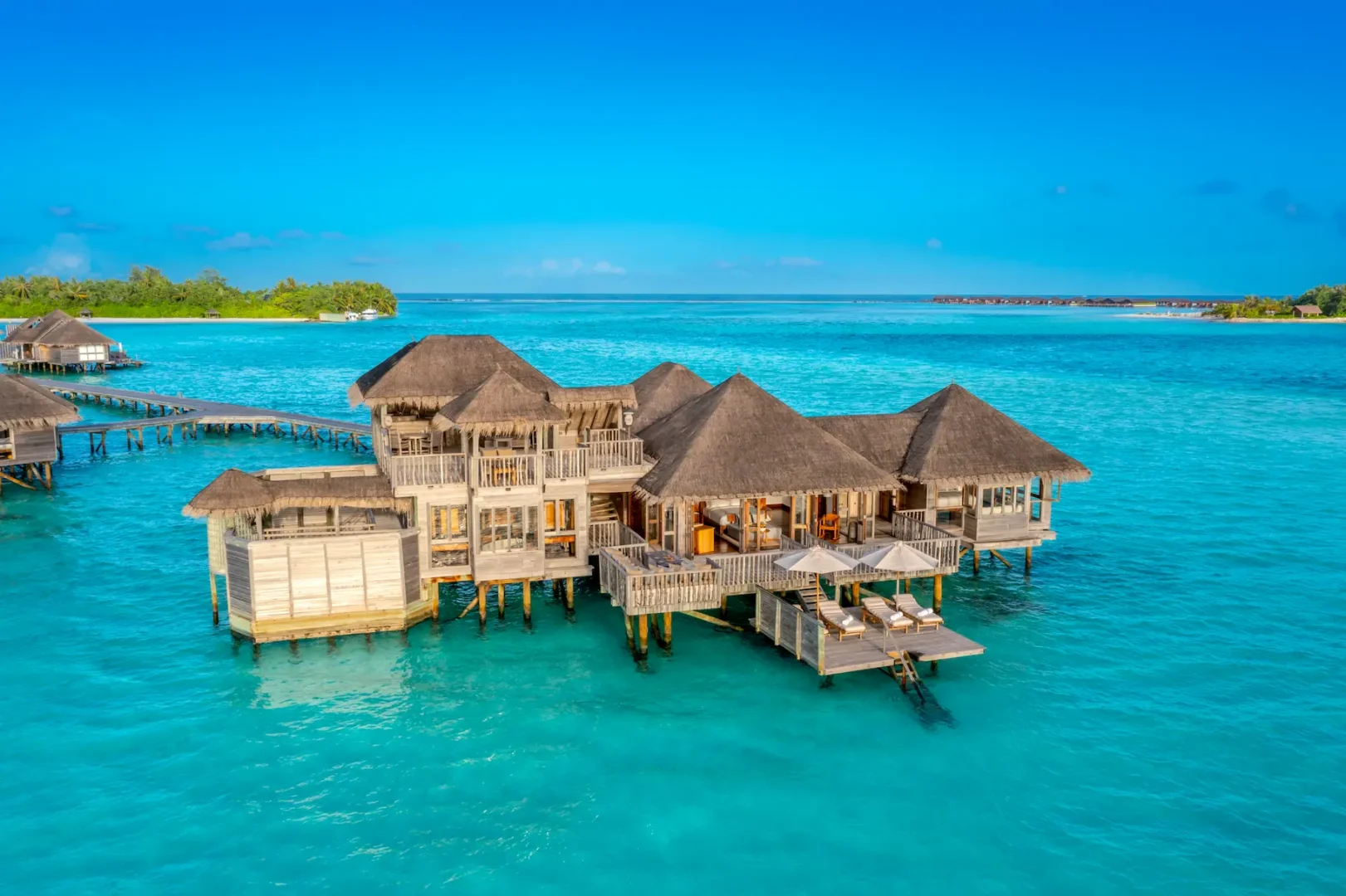an elevated family villa aerial exterior view at gili lankanfushi maldives highlighting its tranquil overwater setting
