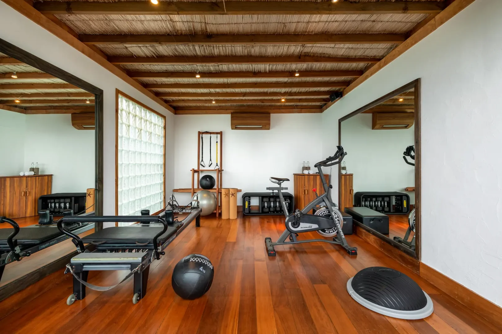 a bright family villa gym at gili lankanfushi maldives featuring natural materials and calming lagoon views