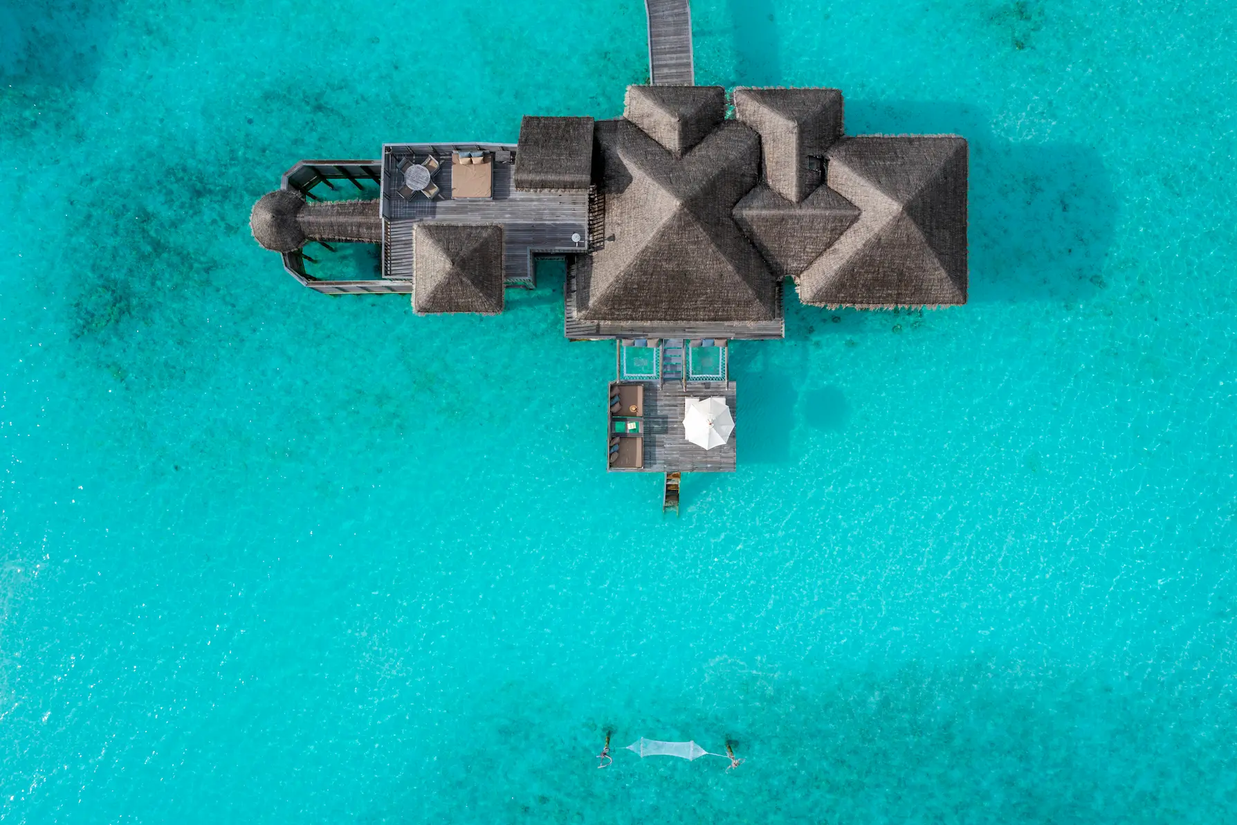 an elevated view of the gili lagoon residence at gili lankanfushi maldives showcasing its expansive overwater setting