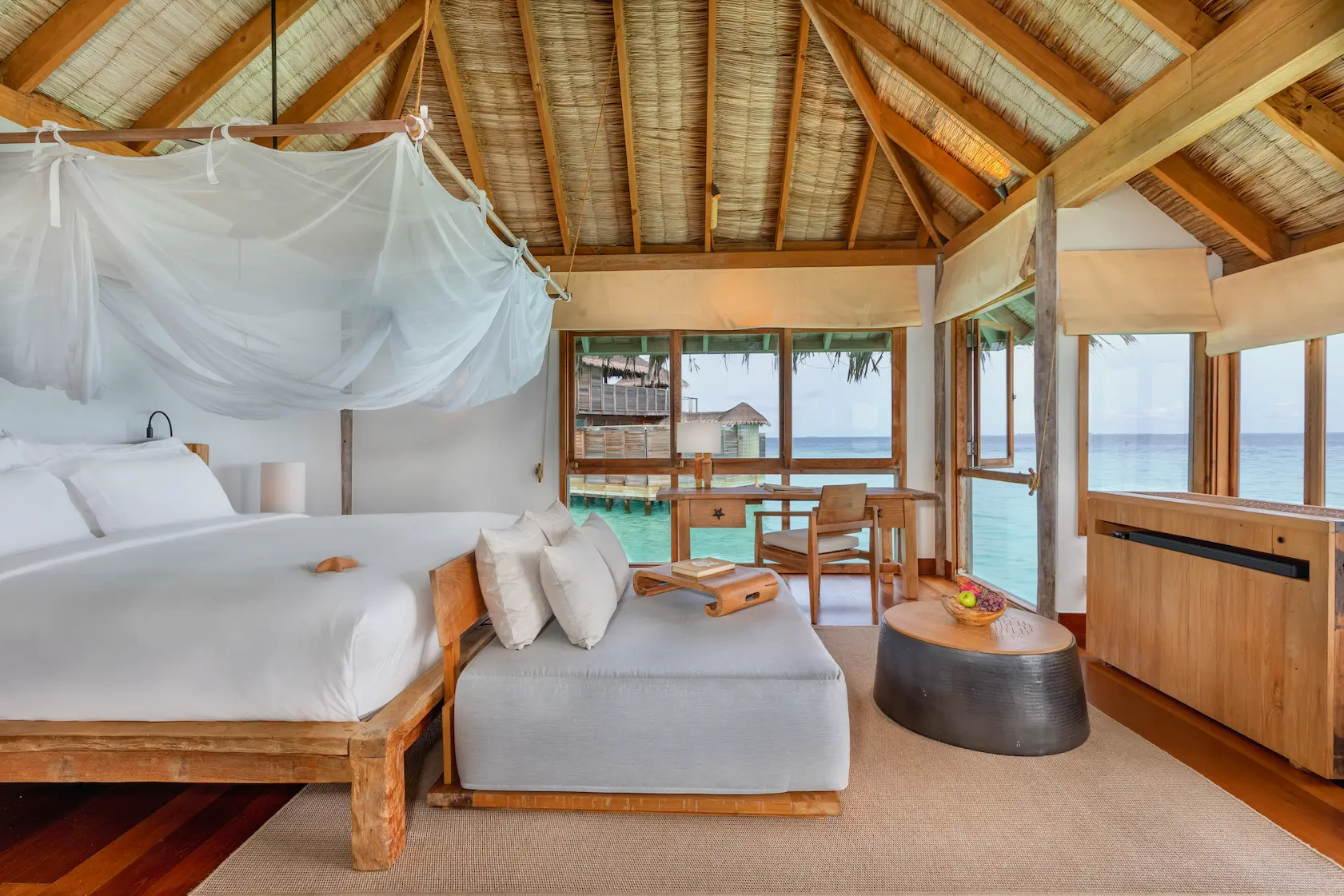 a tranquil gili lagoon residence bedroom at gili lankanfushi maldives featuring soft natural textures and serene lagoon views