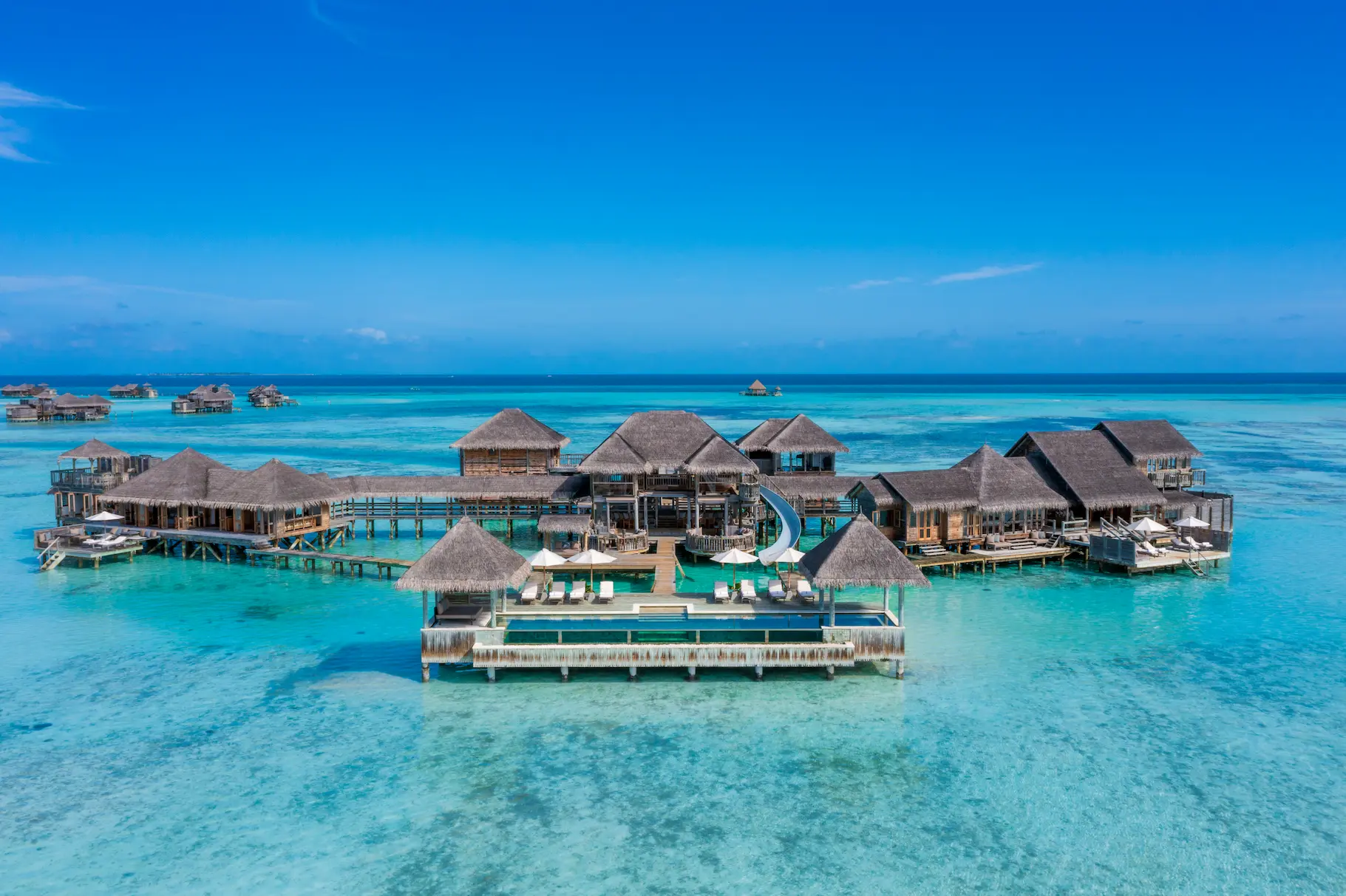 an elevated private reserve aerial exterior view at gili lankanfushi maldives showcasing its expansive overwater setting