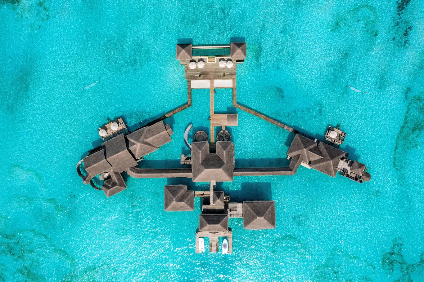 an elevated private reserve aerial view at gili lankanfushi maldives showcasing its expansive overwater setting
