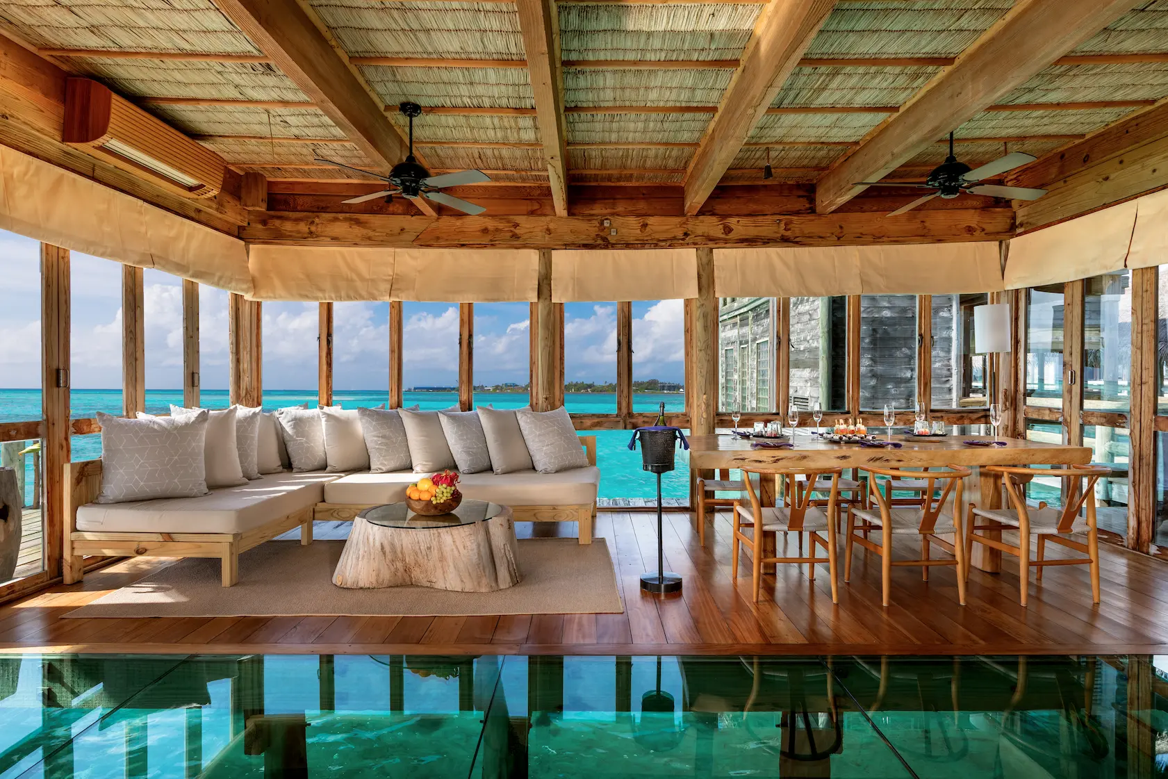a welcoming private reserve entrance lobby at gili lankanfushi maldives featuring natural materials and serene overwater ambience