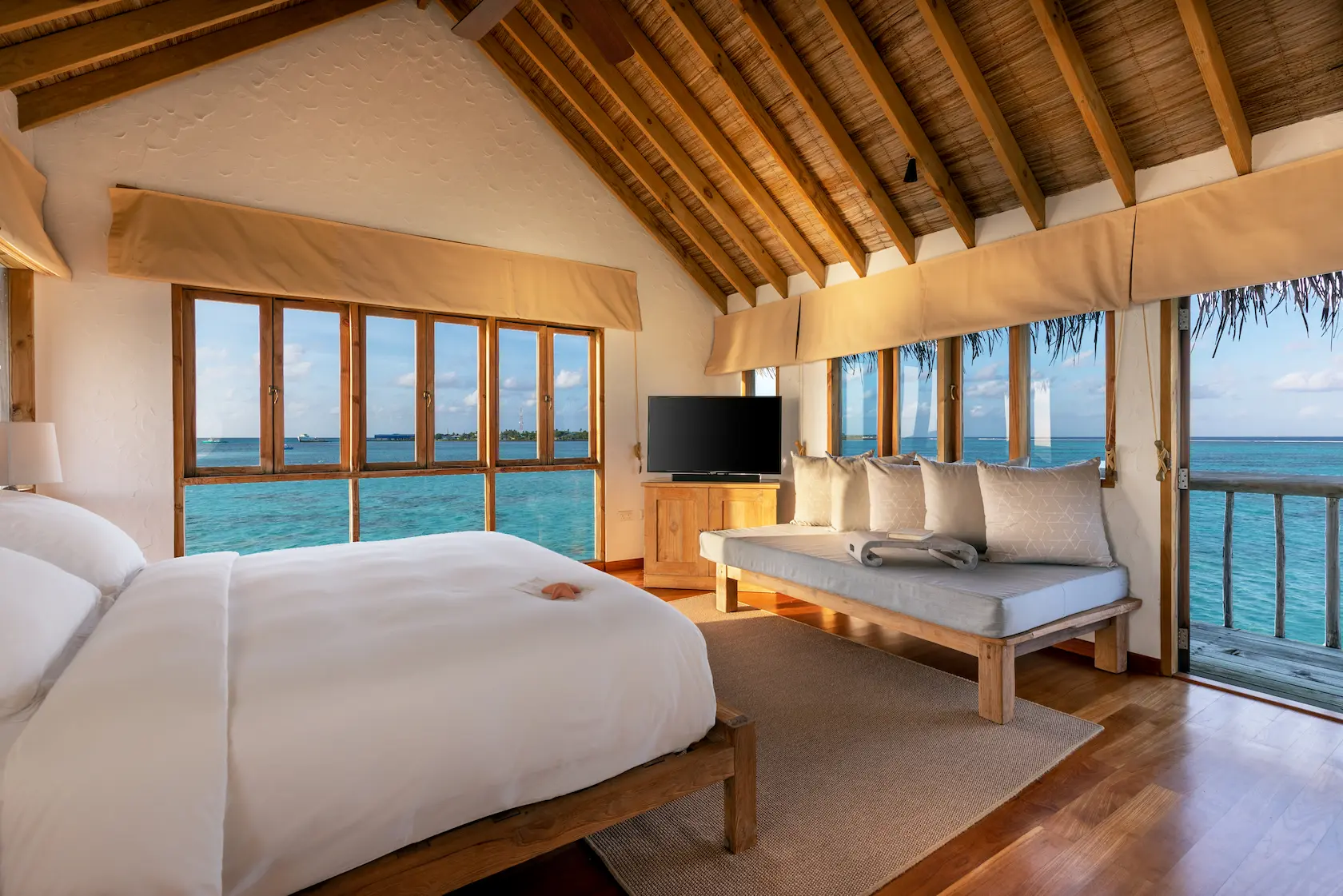 a bright private reserve kids bedroom at gili lankanfushi maldives featuring natural materials and a calm family friendly lagoon setting