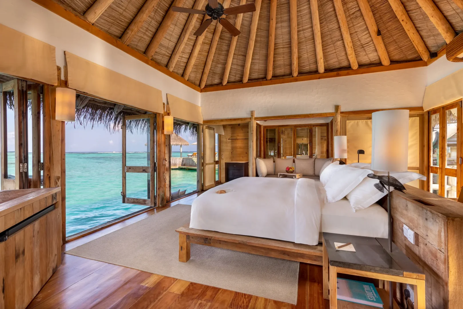 a serene private reserve master bedroom at gili lankanfushi maldives featuring soft natural textures and tranquil lagoon views