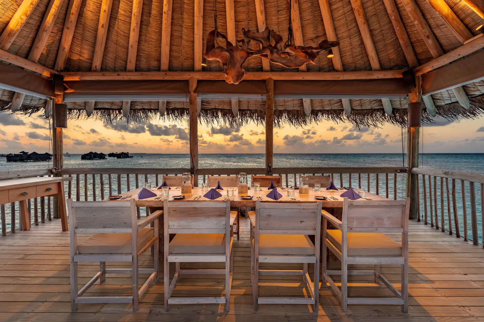 a refined private reserve upstairs dining area at gili lankanfushi maldives offering elevated views across the turquoise lagoon
