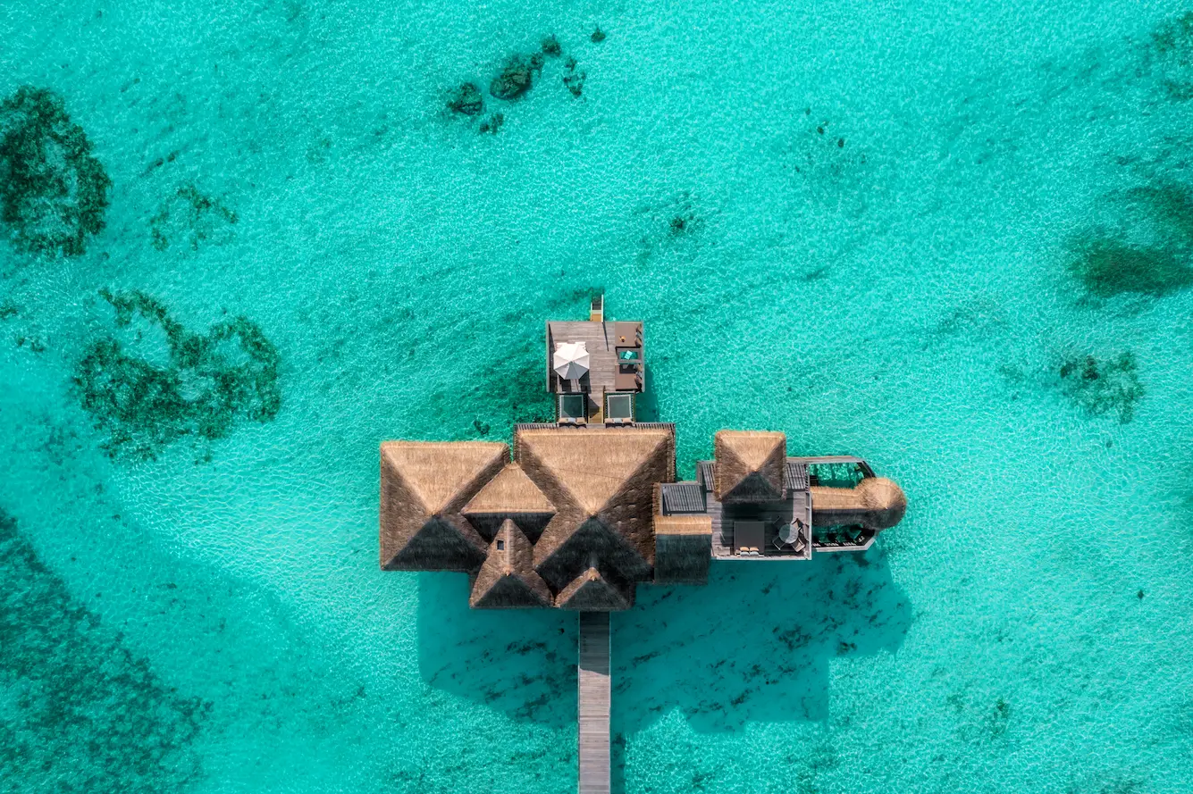an elevated view of the residence at gili lankanfushi maldives showcasing its expansive overwater setting
