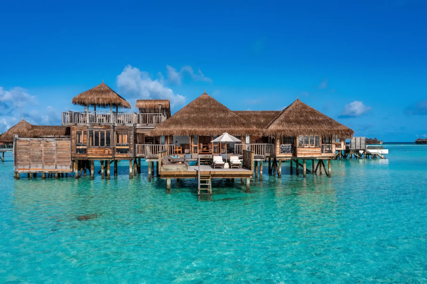 an inviting residence exterior at gili lankanfushi maldives set above clear turquoise lagoon waters