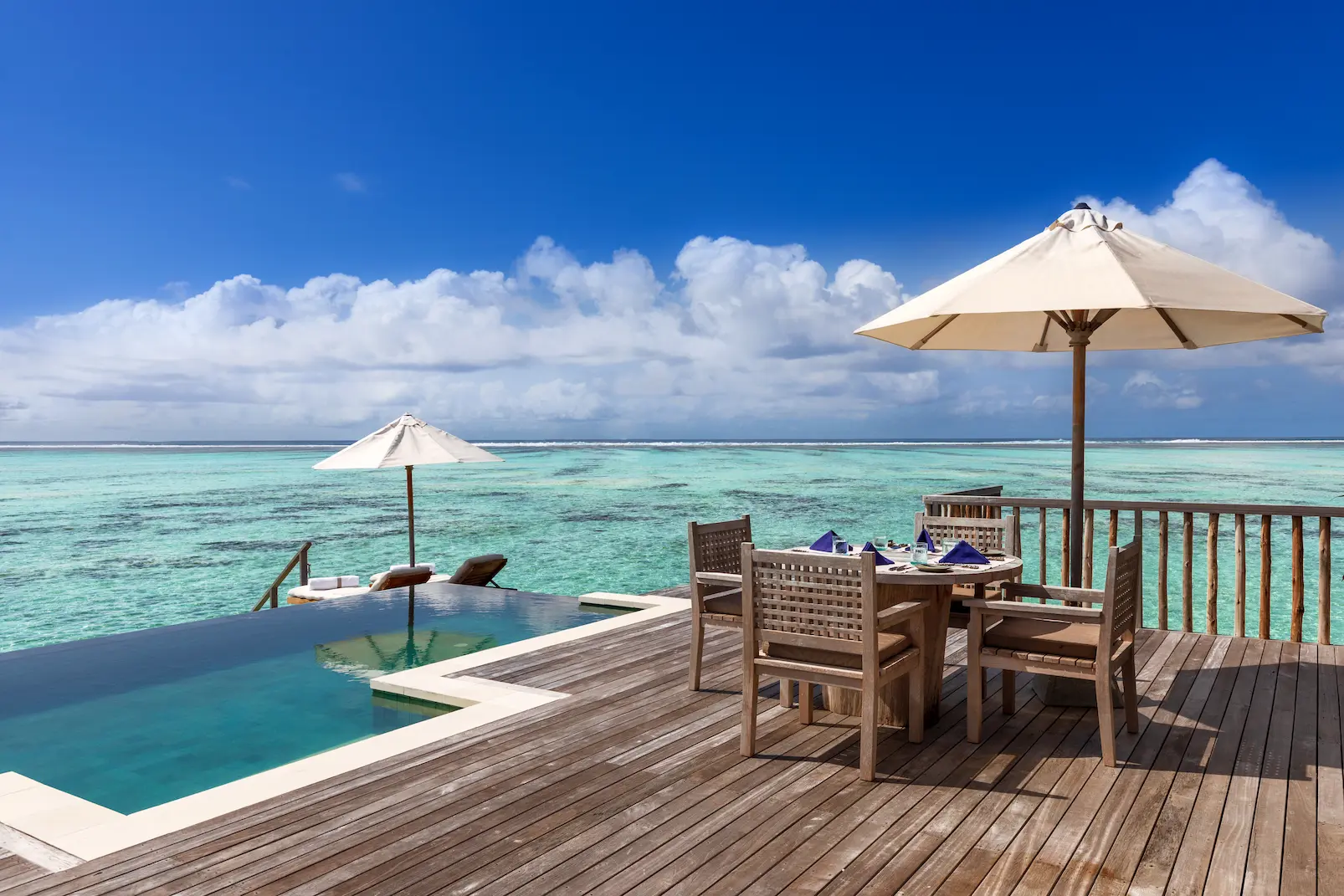 a tranquil residence with pool deck at gili lankanfushi maldives overlooking clear turquoise lagoon water