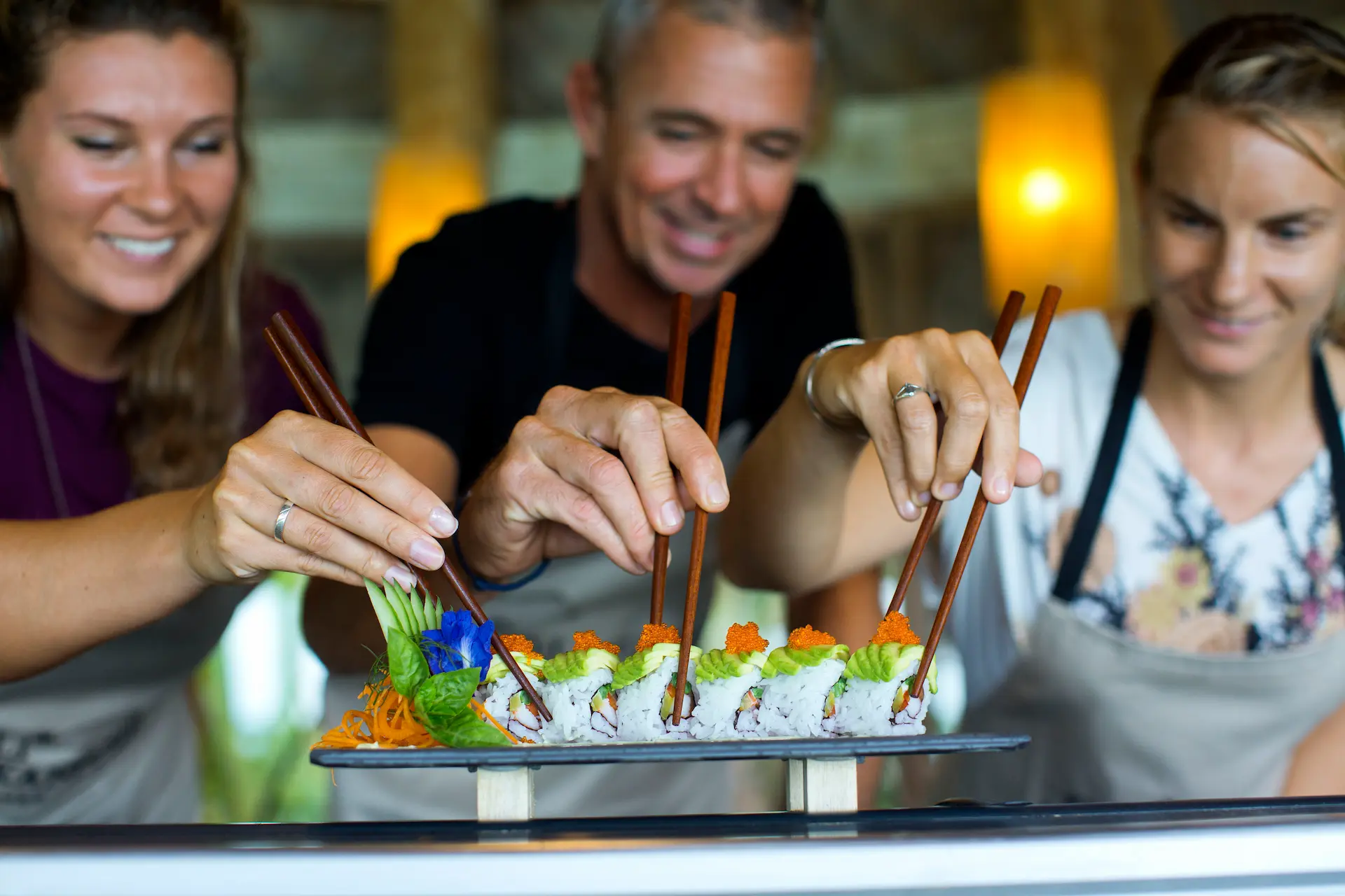 a hands on sushi making class at gili lankanfushi maldives showcasing fresh flavours and a relaxed culinary atmosphere