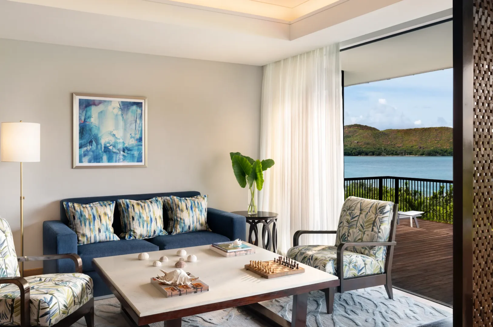 lounge area of grand ocean view pool villa in seychelles with seating