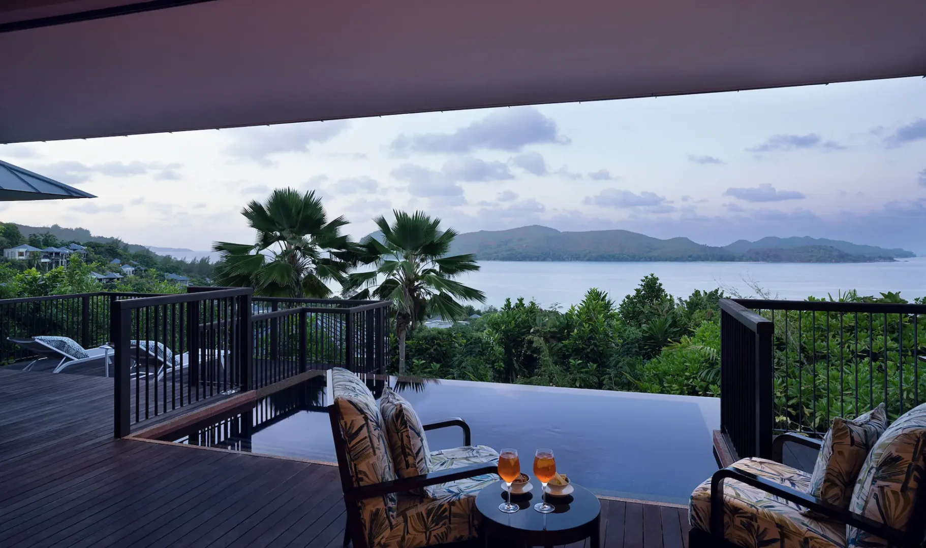 sunset view from grand panoramic pool villa in seychelles with private pool