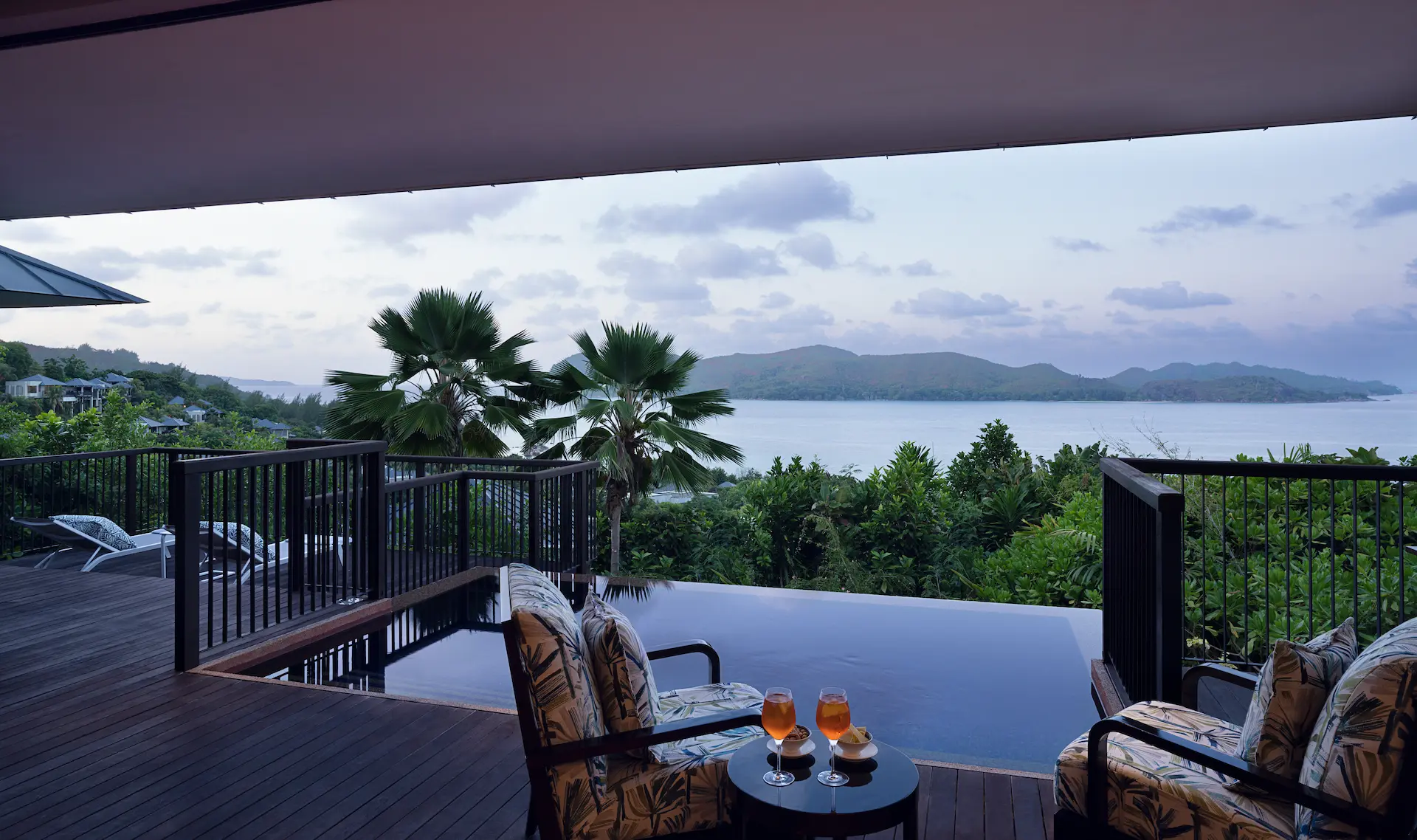 sunset view from grand panoramic pool villa in seychelles with private pool