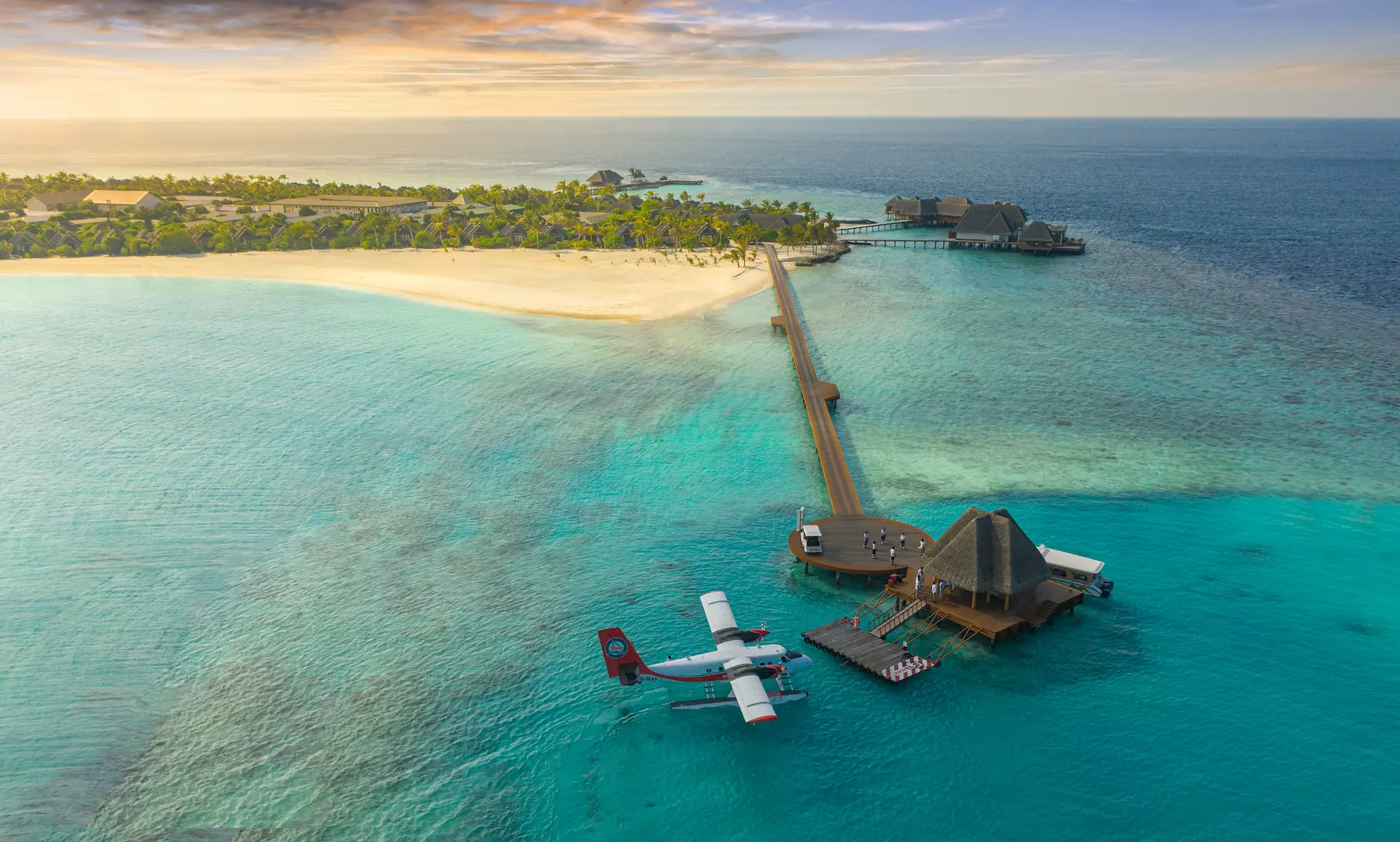 heritance aarah maldives arrival jetty offering a serene overwater welcome point framed by turquoise lagoon views