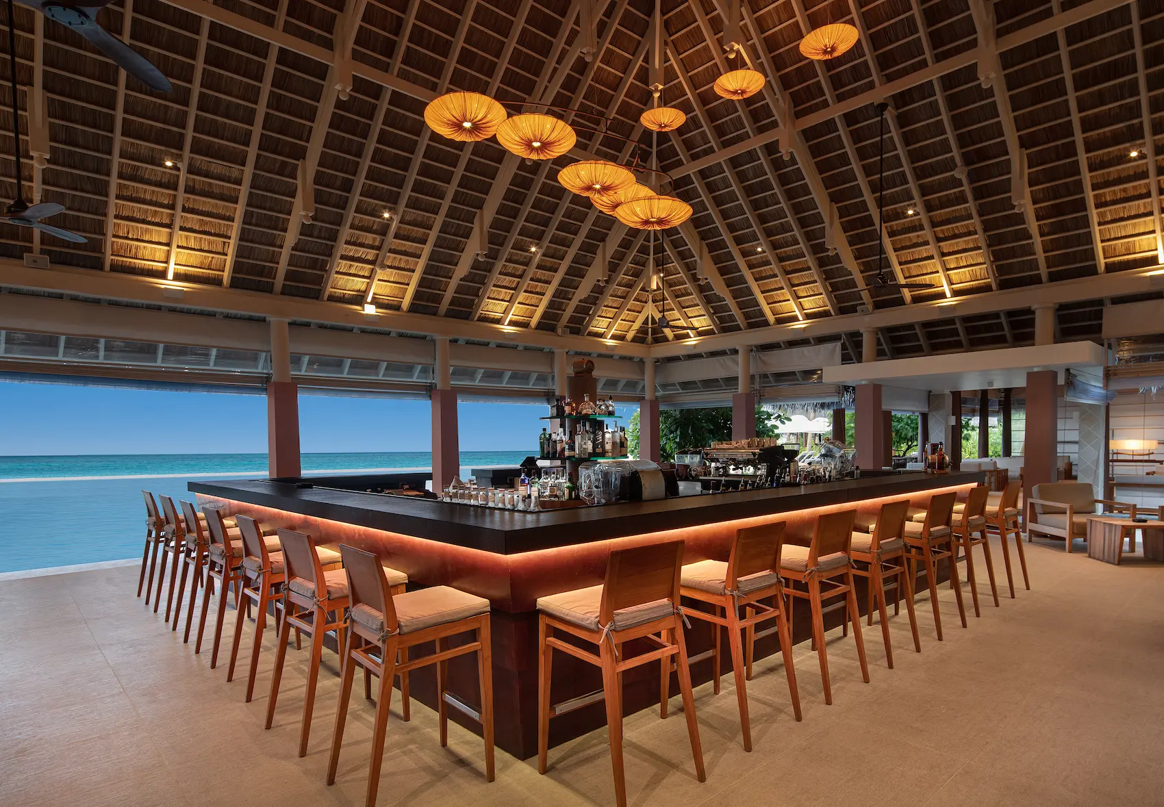 heritance aarah maldives bandi bar offering an elegant beachfront setting with relaxed tropical ambience