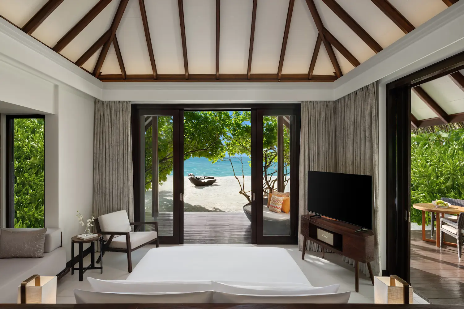 heritance aarah maldives beach villa bed in a serene beachfront setting