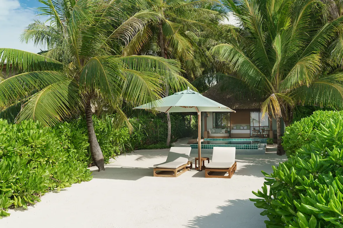 heritance aarah maldives deluxe beach bungalow terrace offering a tranquil beachfront outdoor space with soft tropical light and serene island ambience