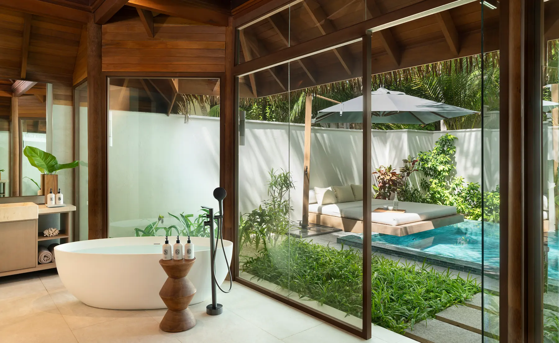 heritance aarah maldives deluxe beach bungalow with pools bathroom offering an elegant beachfront ensuite with refined finishes and a serene tropical ambience