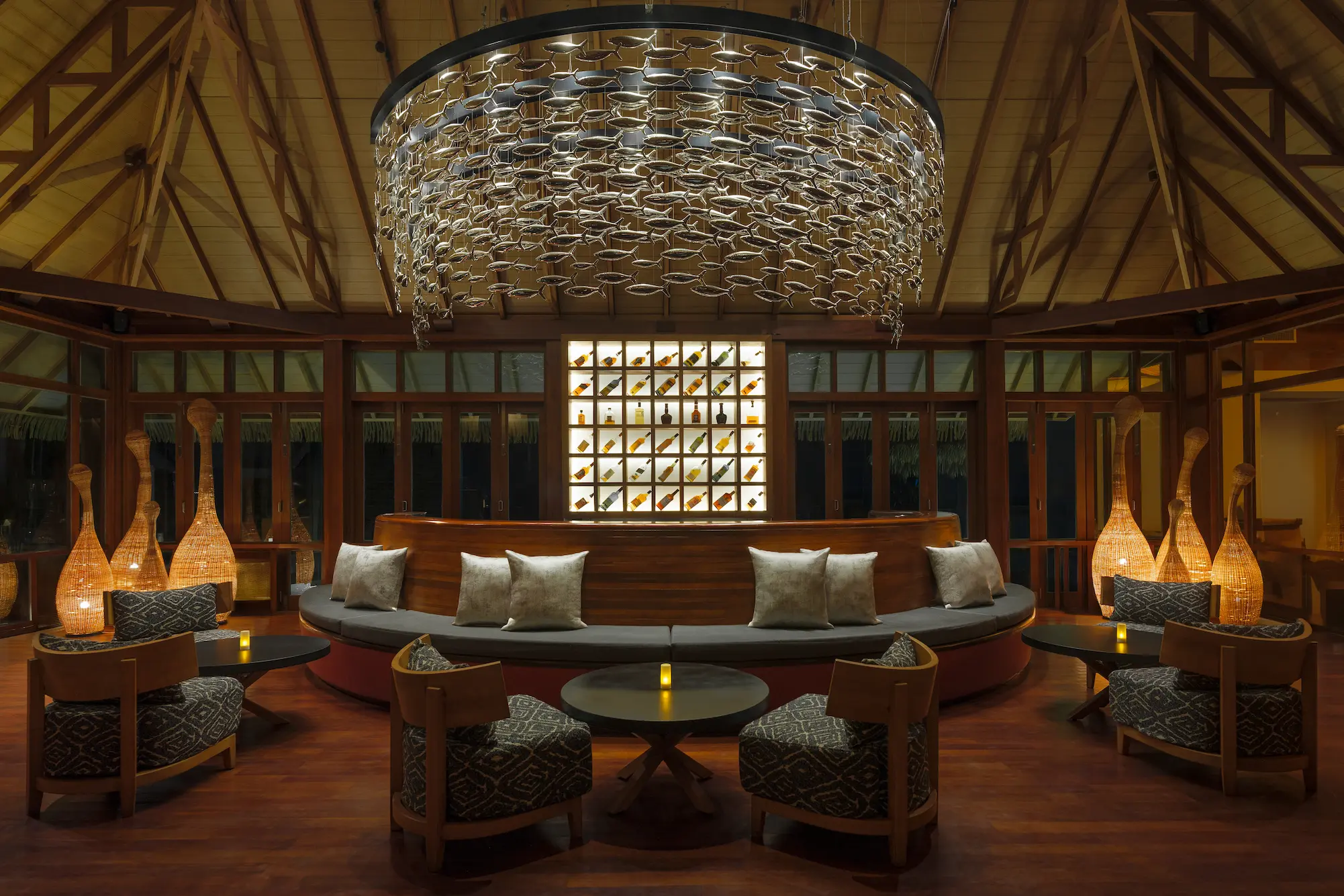 heritance aarah maldives falhu bar night view showcasing an elegant beachfront setting with warm ambient lighting and serene evening atmosphere