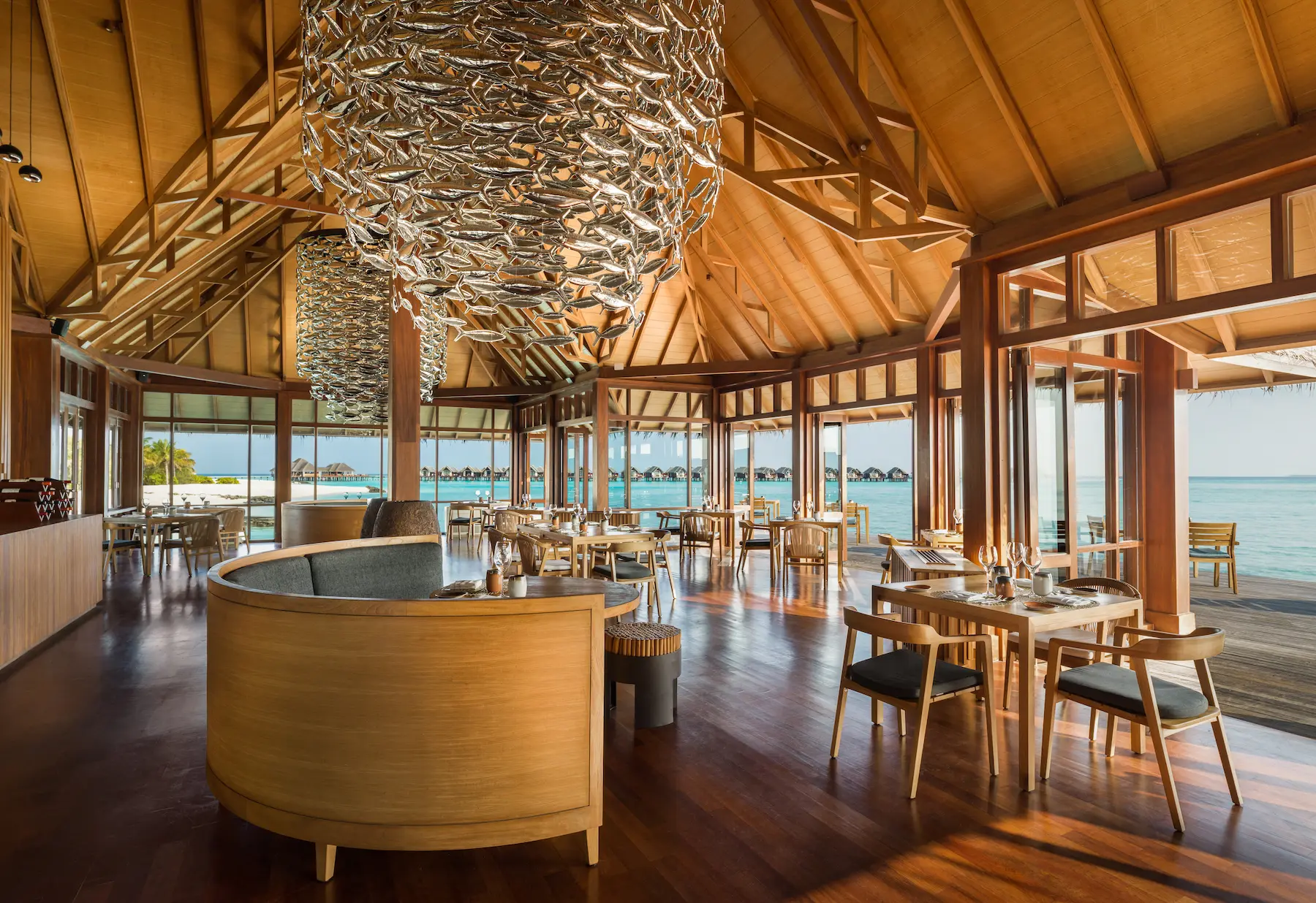 heritance aarah maldives interior baani restaurant at daylight showcasing an elegant dining space illuminated by soft natural light with refined tropical ambience