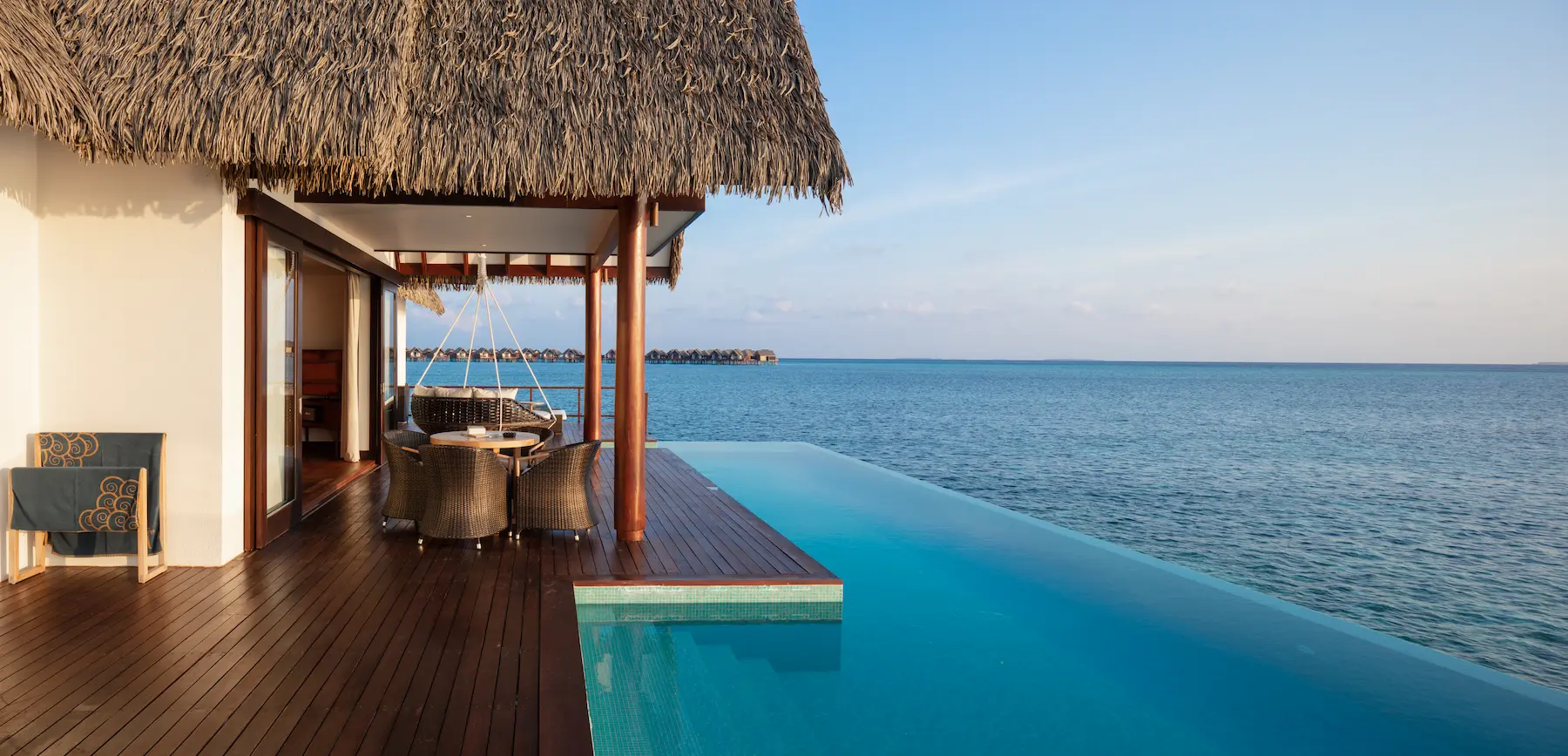 heritance aarah maldives ocean residence deck offering a serene overwater setting with elegant lounging space and tranquil turquoise lagoon views