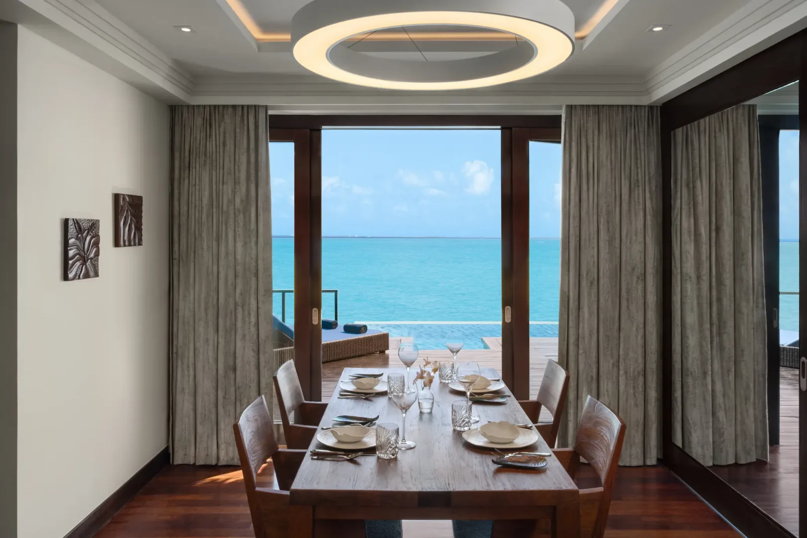 heritance aarah maldives ocean residence dining room featuring an elegant overwater setting with refined natural textures and serene lagoon views