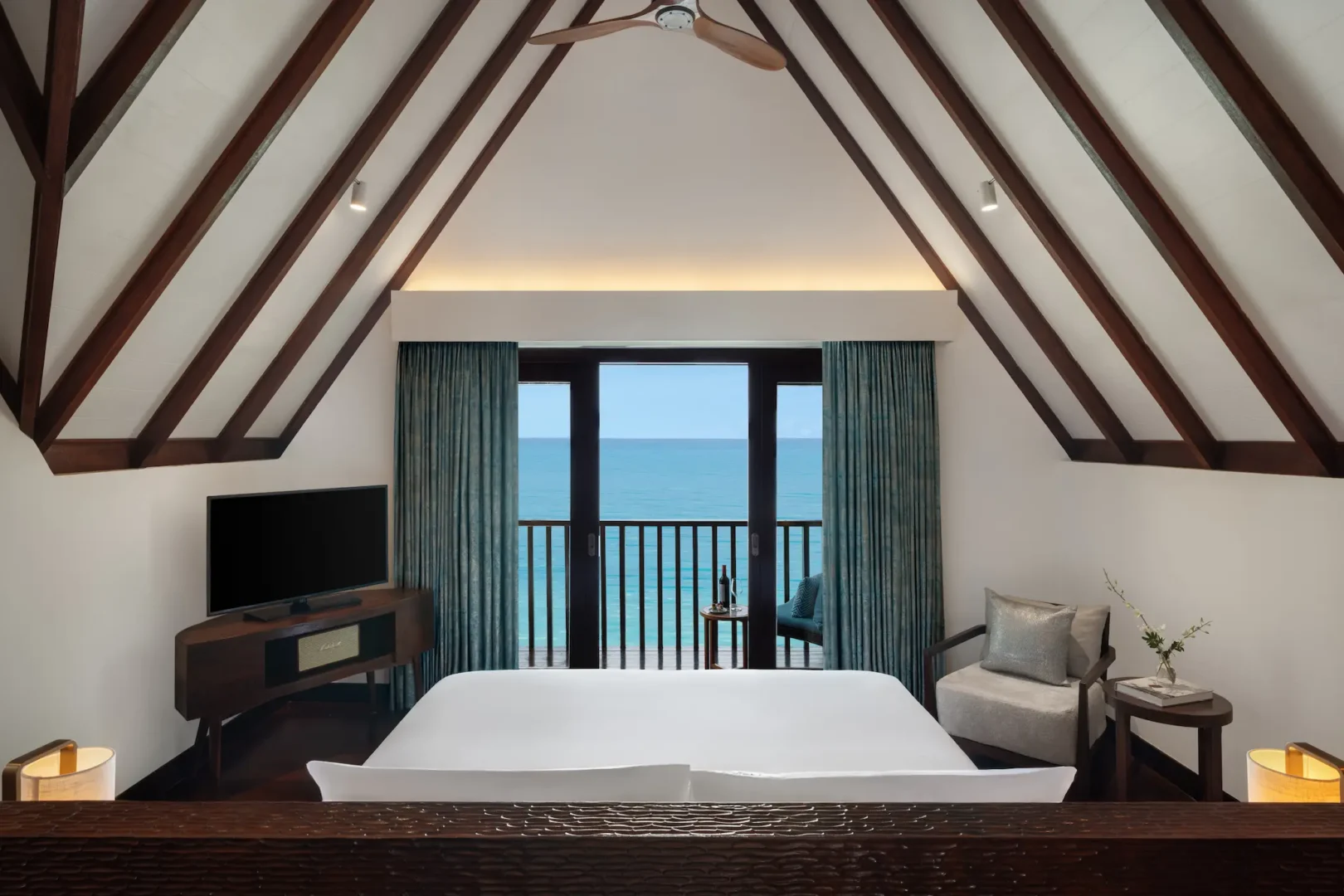 heritance aarah maldives ocean suite room featuring an elegant overwater interior with refined natural textures and serene lagoon facing ambience