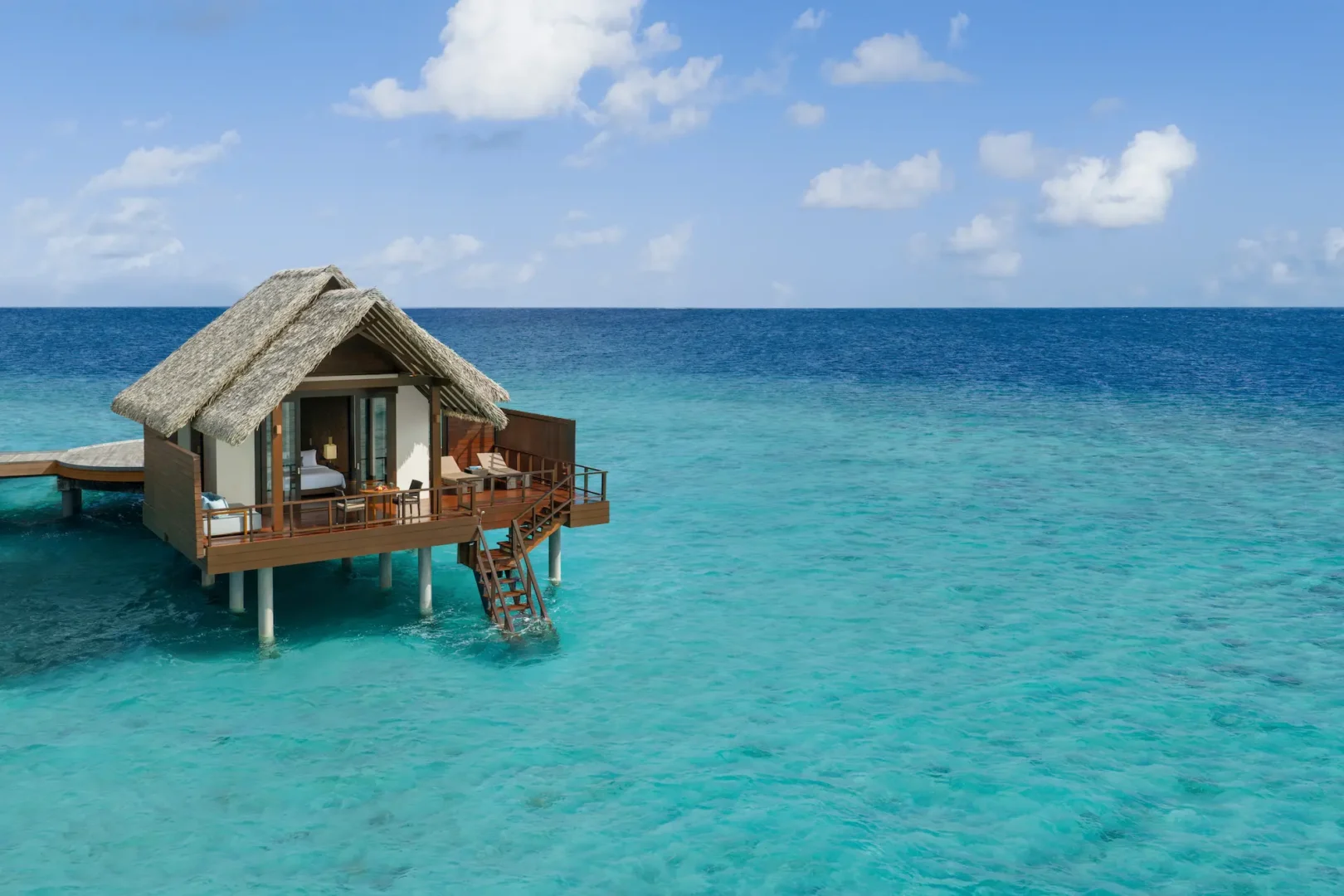 heritance aarah maldives ocean villa aerial facade showcasing an elegant overwater exterior surrounded by tranquil turquoise lagoon views