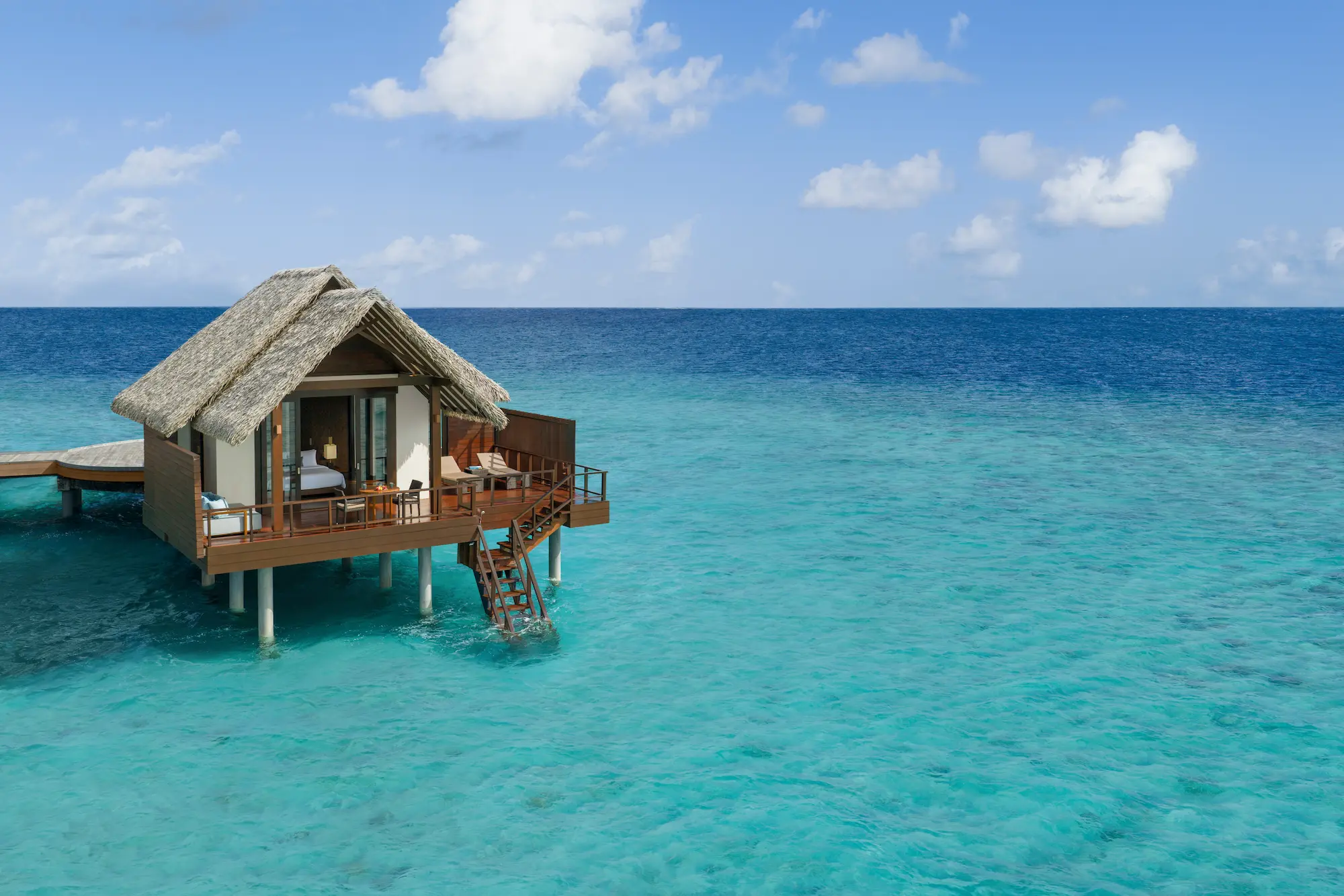 heritance aarah maldives ocean villa aerial facade showcasing an elegant overwater exterior surrounded by tranquil turquoise lagoon views